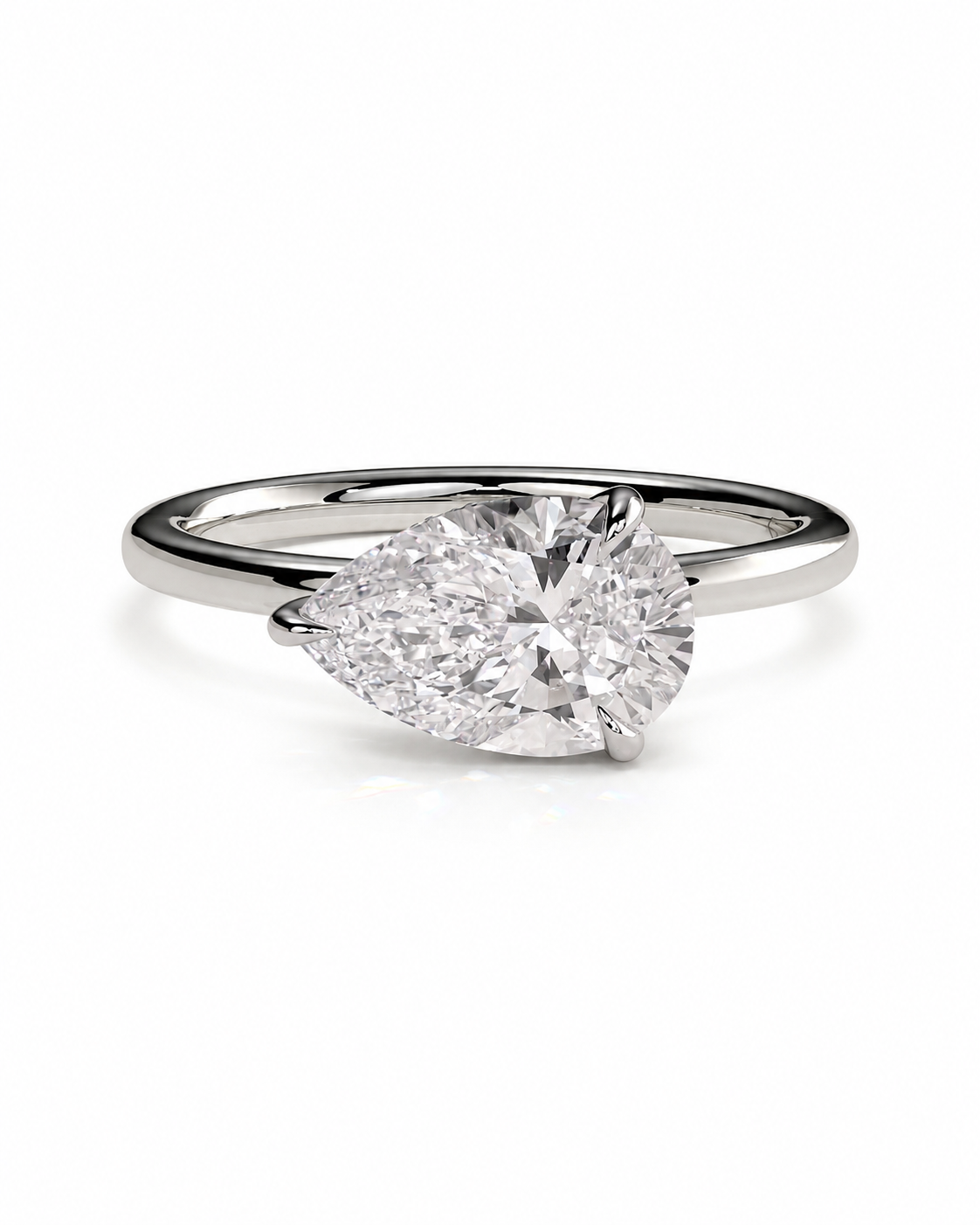 color_925_SIL,color_935_ARG,color_10K_WG, color_14K_WG &&A pear-cut diamond engagement ring in a polished silver-colored metal band, shown on a clean white background.