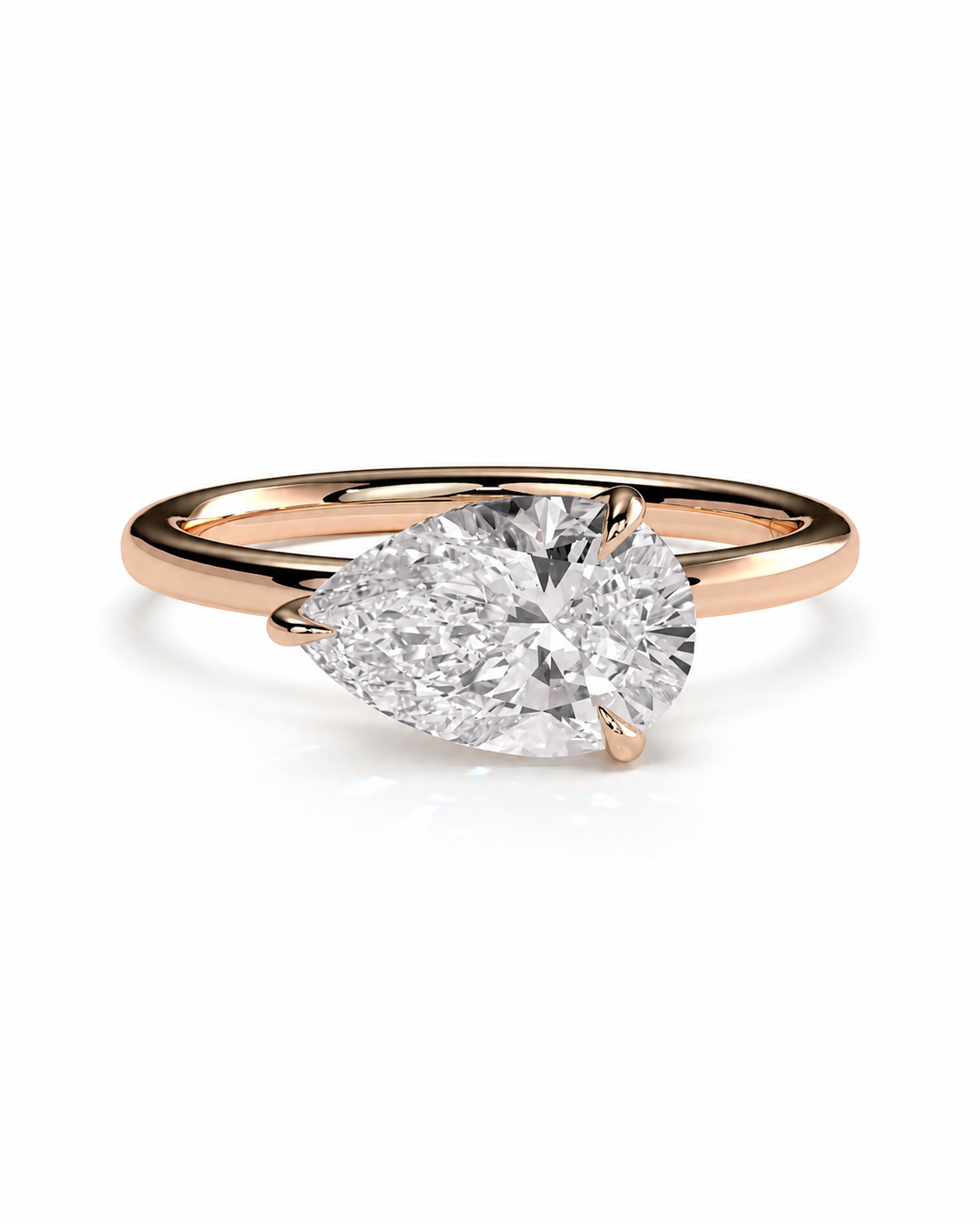 color_10K_RG, color_14K_RG &&A rose gold solitaire engagement ring featuring a large pear-cut diamond center stone, set against a clean white background.