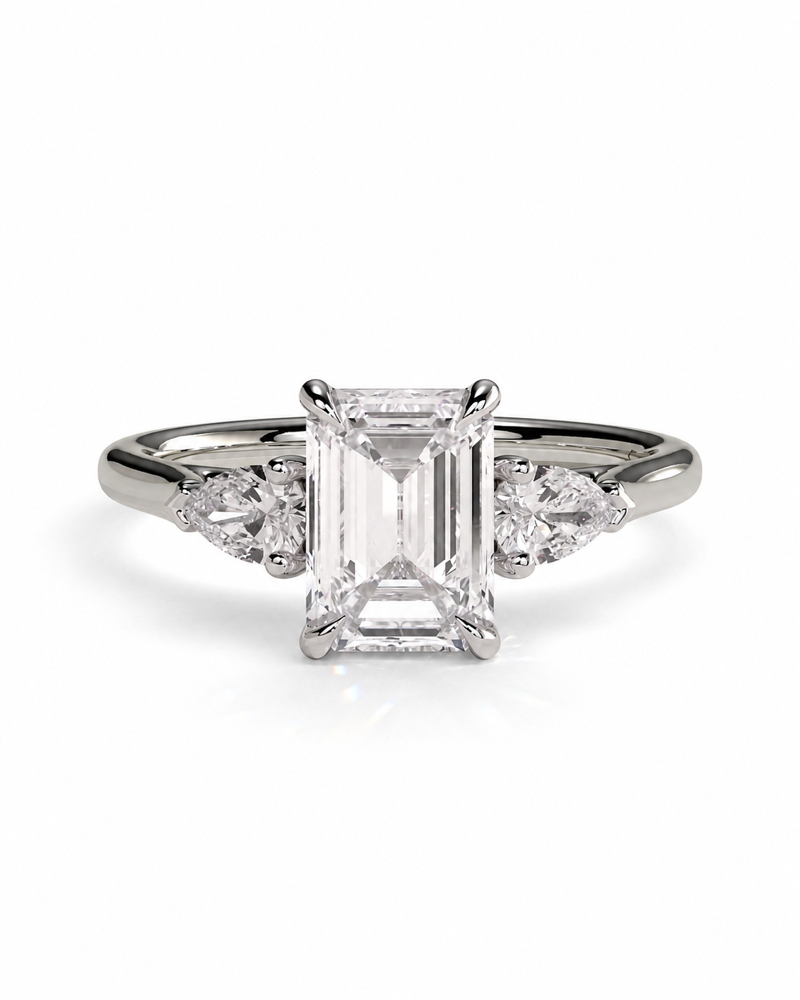 color_925_SIL,color_935_ARG,color_10K_WG, color_14K_WG &&An emerald-cut diamond engagement ring with a silver-toned band and small round and marquise side diamonds, centered on a white background.