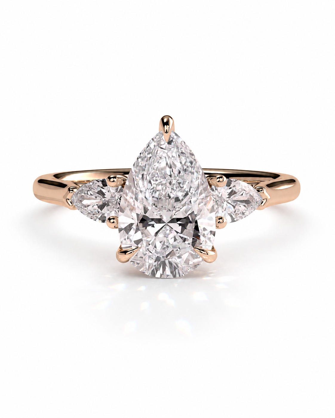 color_10K_RG, color_14K_RG &&A rose gold diamond ring with a pear-cut center stone and marquise-cut side stones, shown on a clean white background.