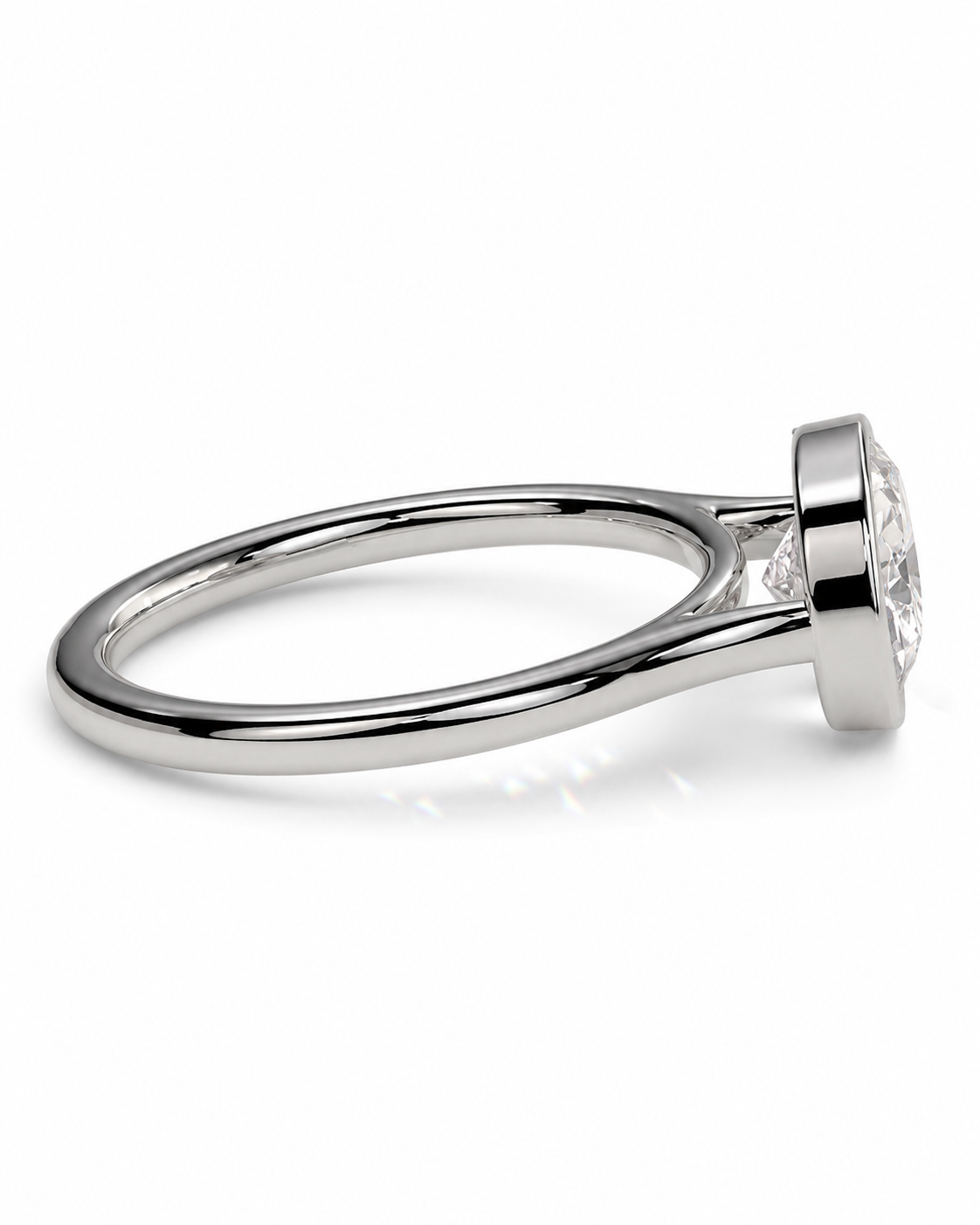 color_925_SIL,color_935_ARG,color_10K_WG, color_14K_WG &&A silver-toned diamond engagement ring with a round brilliant-cut center stone in a bezel setting, shown on a clean white background.