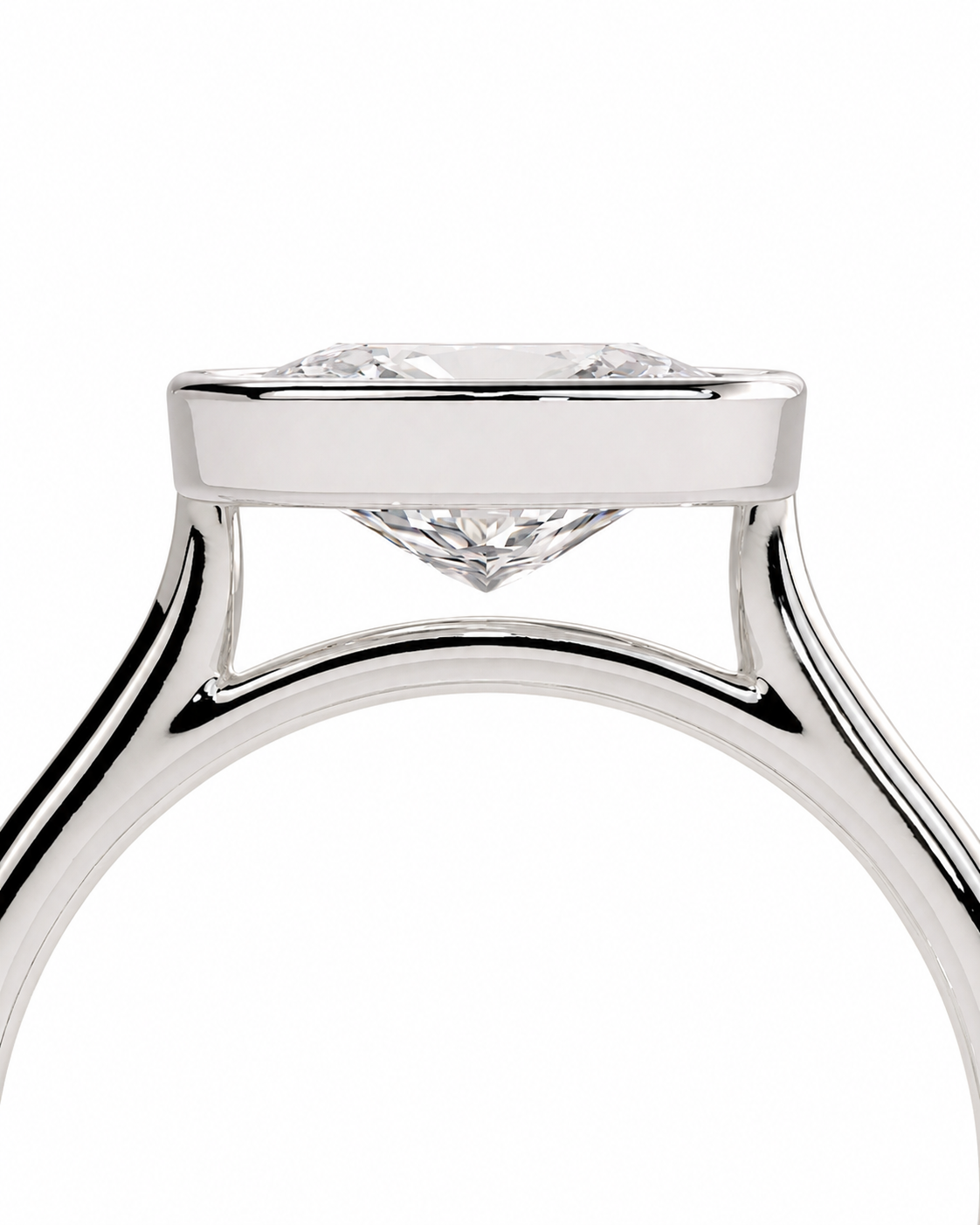 color_925_SIL,color_935_ARG,color_10K_WG, color_14K_WG &&Close-up of a silver-toned diamond ring with a square-cut clear gemstone in a prong setting, shown against a plain white background.