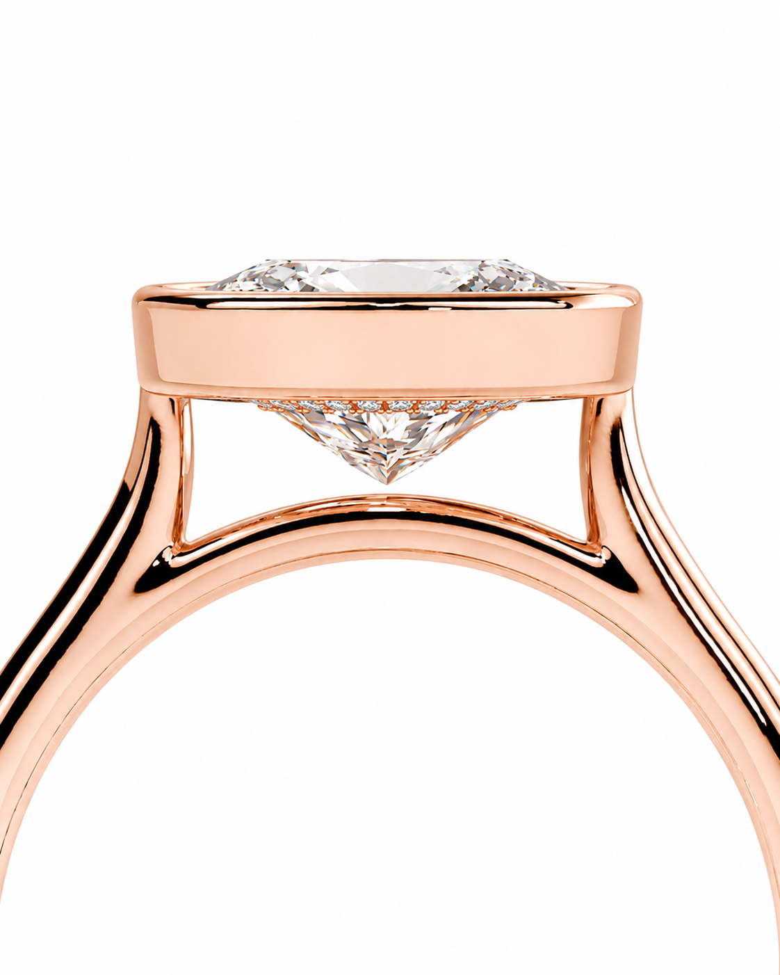 color_10K_RG, color_14K_RG &&Close-up of a rose gold ring setting with a clear gemstone, shown on a plain white background.