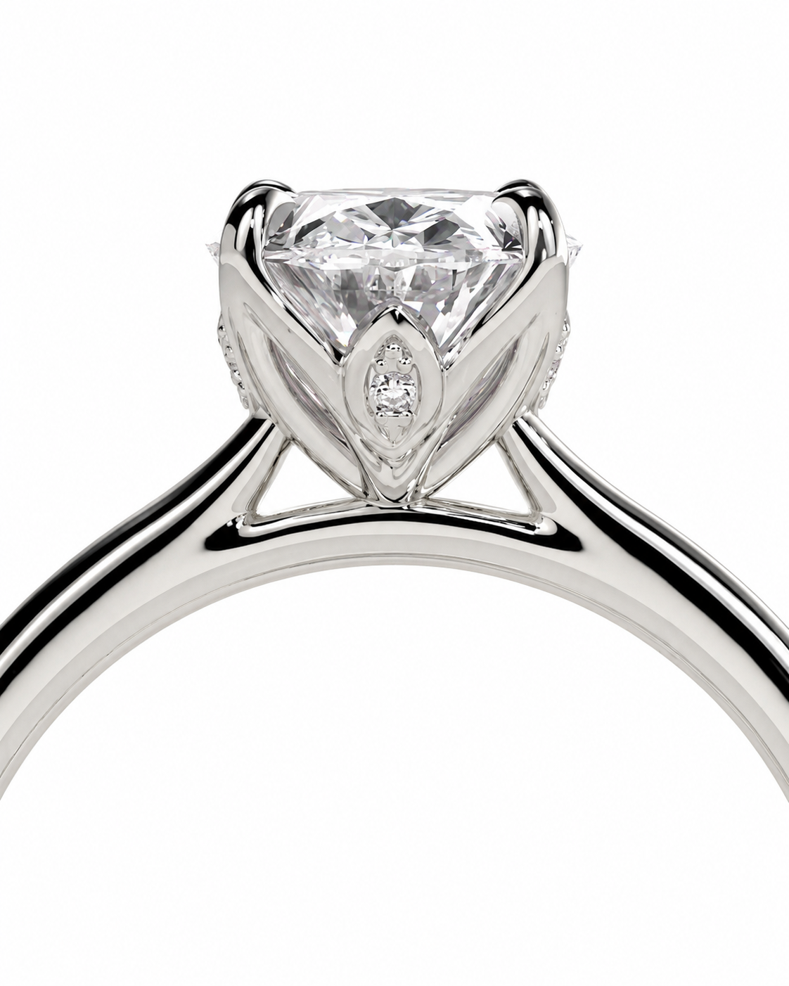 color_925_SIL,color_935_ARG,color_10K_WG, color_14K_WG &&A close-up studio shot of a silver-toned solitaire engagement ring with a large round brilliant-cut diamond and a small marquise-cut diamond accent in the center, set against a plain white background.