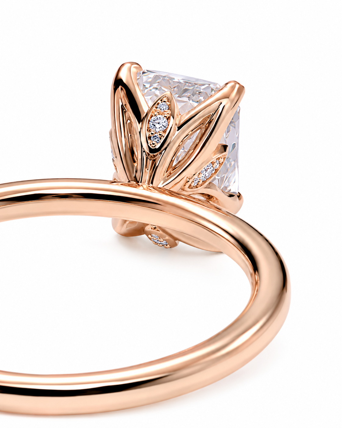 color_10K_RG, color_14K_RG &&Rose gold ring with a princess-cut clear center stone and small accent diamonds, shown in a close-up studio shot on a white background.