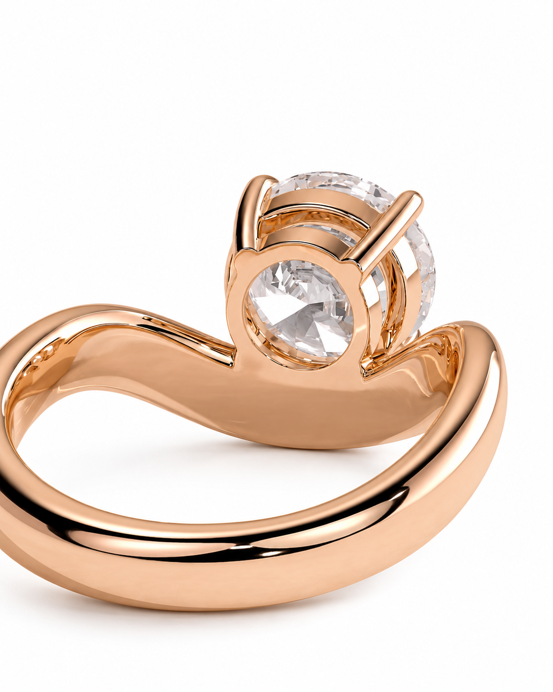 color_10K_RG, color_14K_RG &&A close-up studio shot of a rose gold ring with a curved band and a clear round gemstone in a prong setting, shown against a plain white background.