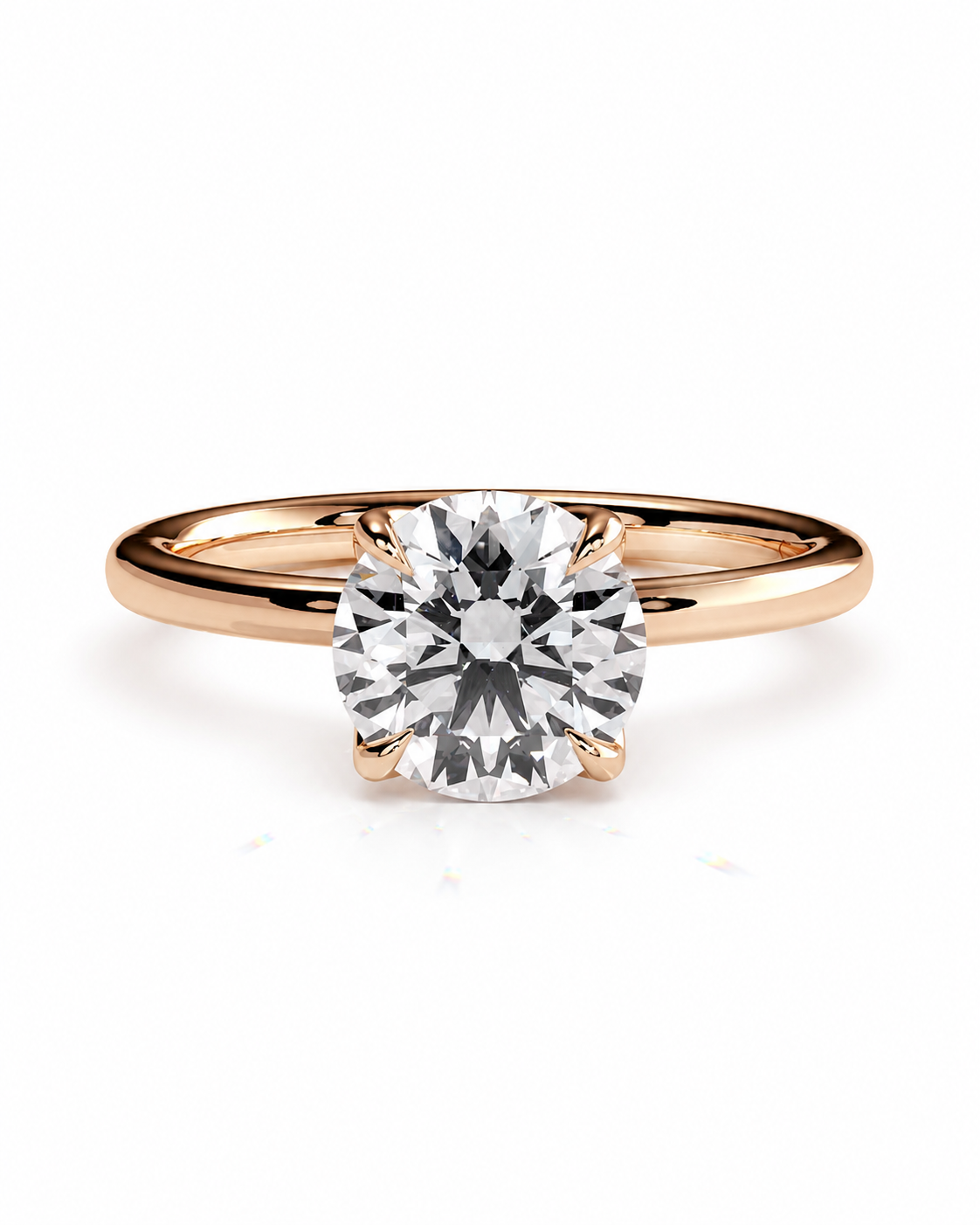 color_10K_RG, color_14K_RG &&A classic solitaire engagement ring featuring a round brilliant-cut diamond set in a rose gold four-prong setting, on a polished rose gold band, shot against a seamless white background.