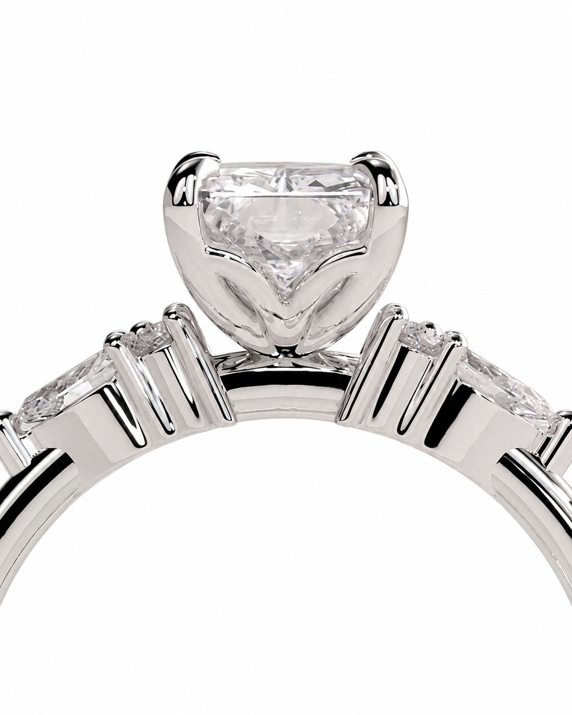 color_925_SIL,color_935_ARG,color_10K_WG, color_14K_WG &&A close-up studio shot of a silver-toned ring featuring a large heart-shaped clear gemstone in a prong setting, with smaller marquise-cut side stones on a white background.