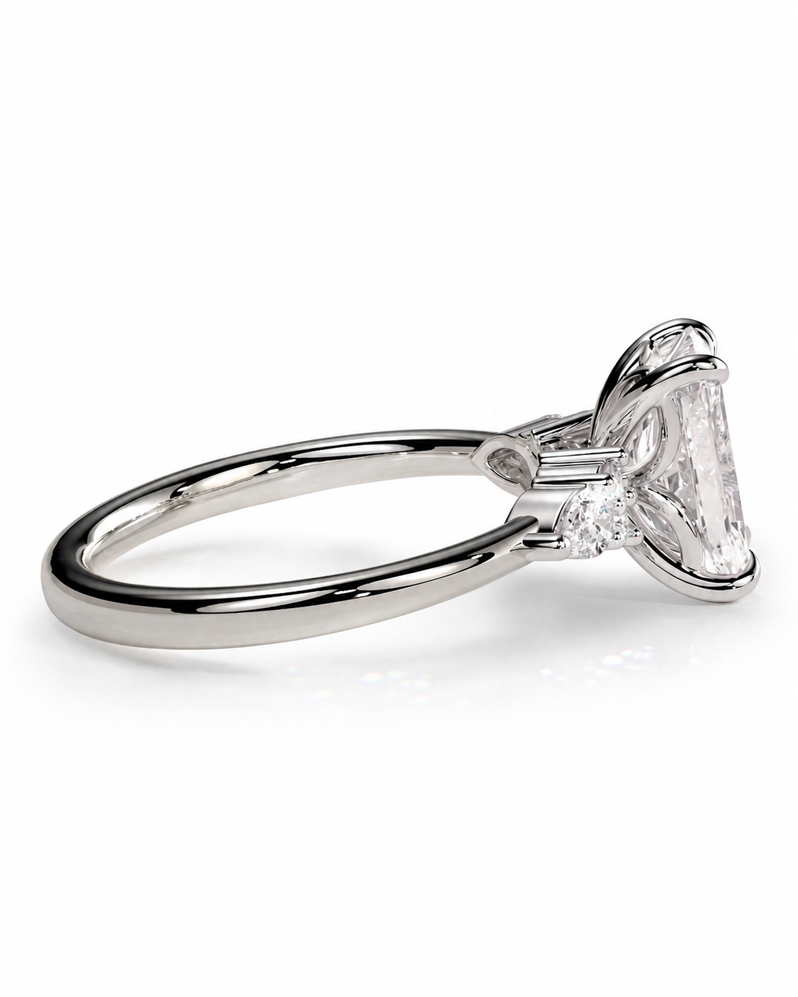 color_925_SIL,color_935_ARG,color_10K_WG, color_14K_WG &&A silver-toned solitaire engagement ring featuring a large rectangular clear gemstone in a prong setting, shown on a clean white background.