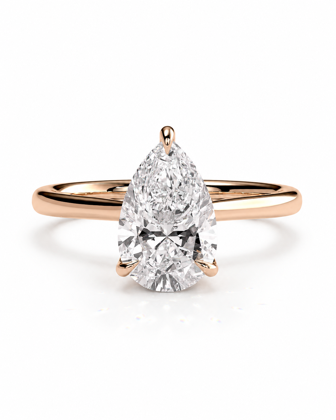 color_10K_RG, color_14K_RG &&A pear-cut diamond engagement ring with a rose gold band, shown on a clean white background.