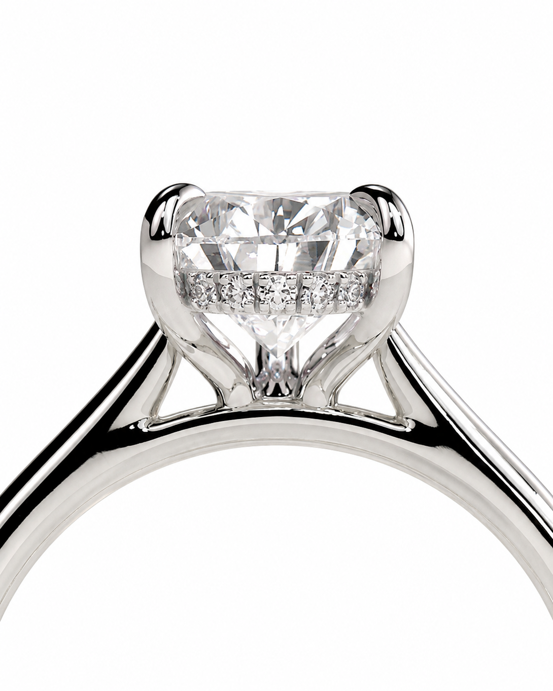 color_925_SIL,color_935_ARG,color_10K_WG, color_14K_WG &&A close-up studio shot of a silver-toned ring with a large clear heart-shaped diamond and a row of smaller diamonds in the halo, set against a plain white background.