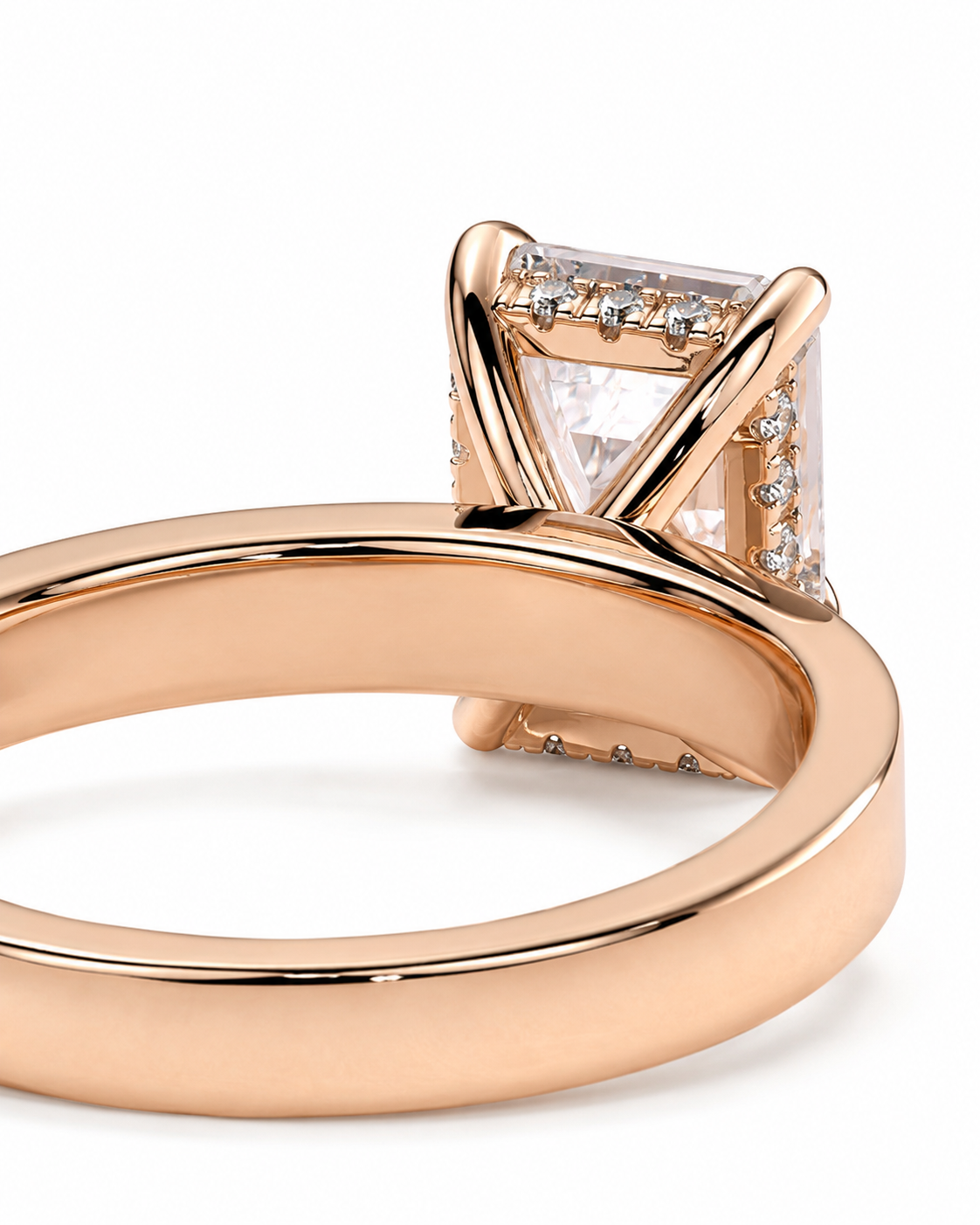 color_10K_RG, color_14K_RG &&Rose gold ring with a square clear gemstone in a prong setting, shown on a clean white background.