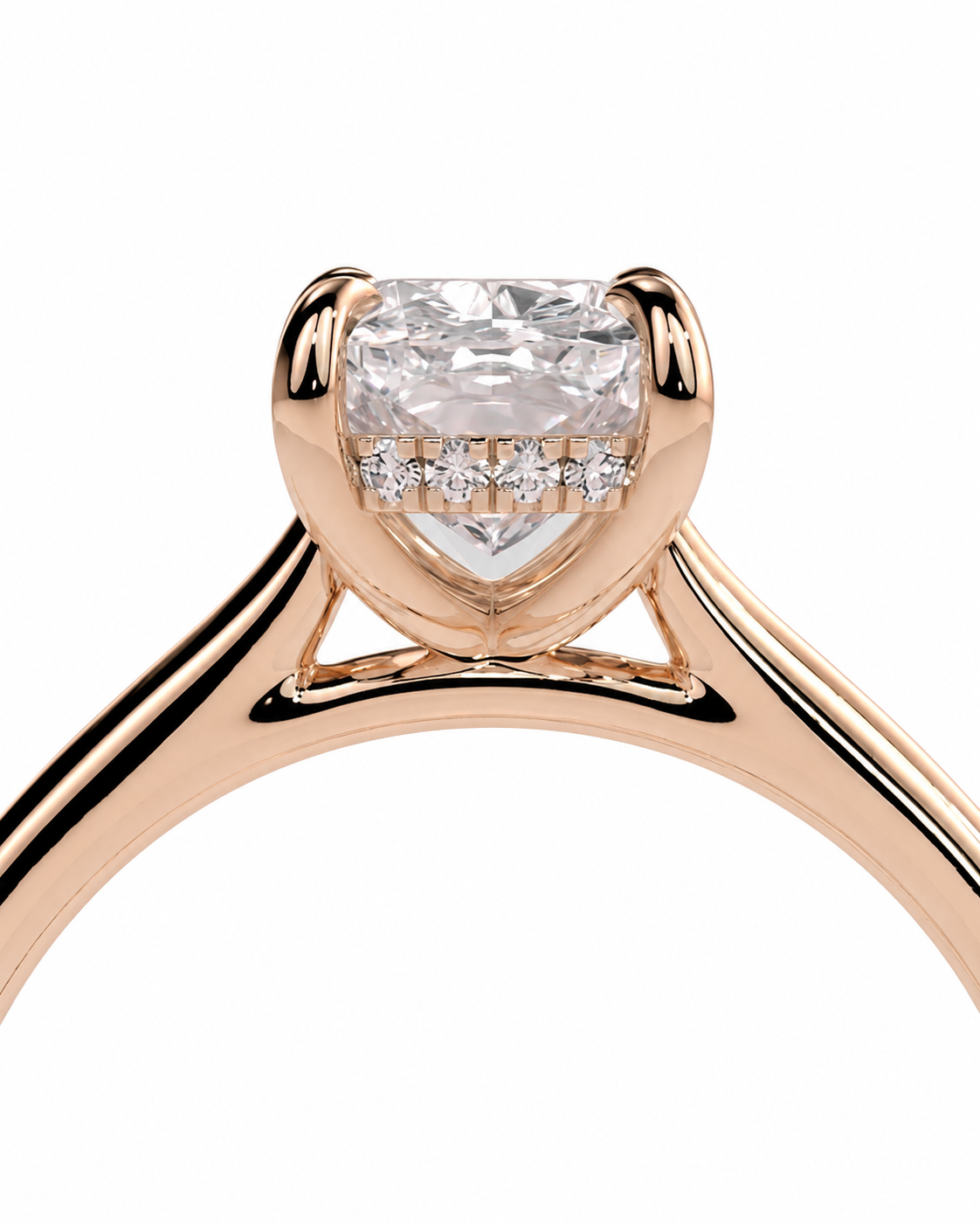 color_10K_RG, color_14K_RG &&A close-up of a rose gold engagement ring featuring a heart-shaped clear center stone and small side stones, set against a plain white background.