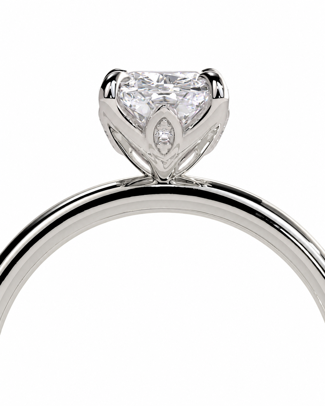 color_925_SIL,color_935_ARG,color_10K_WG, color_14K_WG &&A close-up studio shot of a silver-toned ring featuring a large heart-shaped clear gemstone in a prong setting with a smaller marquise-cut gemstone accent below it, on a plain white background.