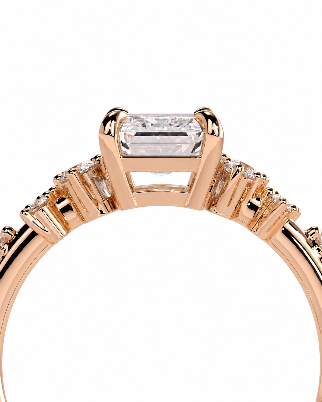 color_10K_RG, color_14K_RG &&Rose gold ring with a rectangular baguette-cut clear center stone and smaller side stones, shown on a plain white background.