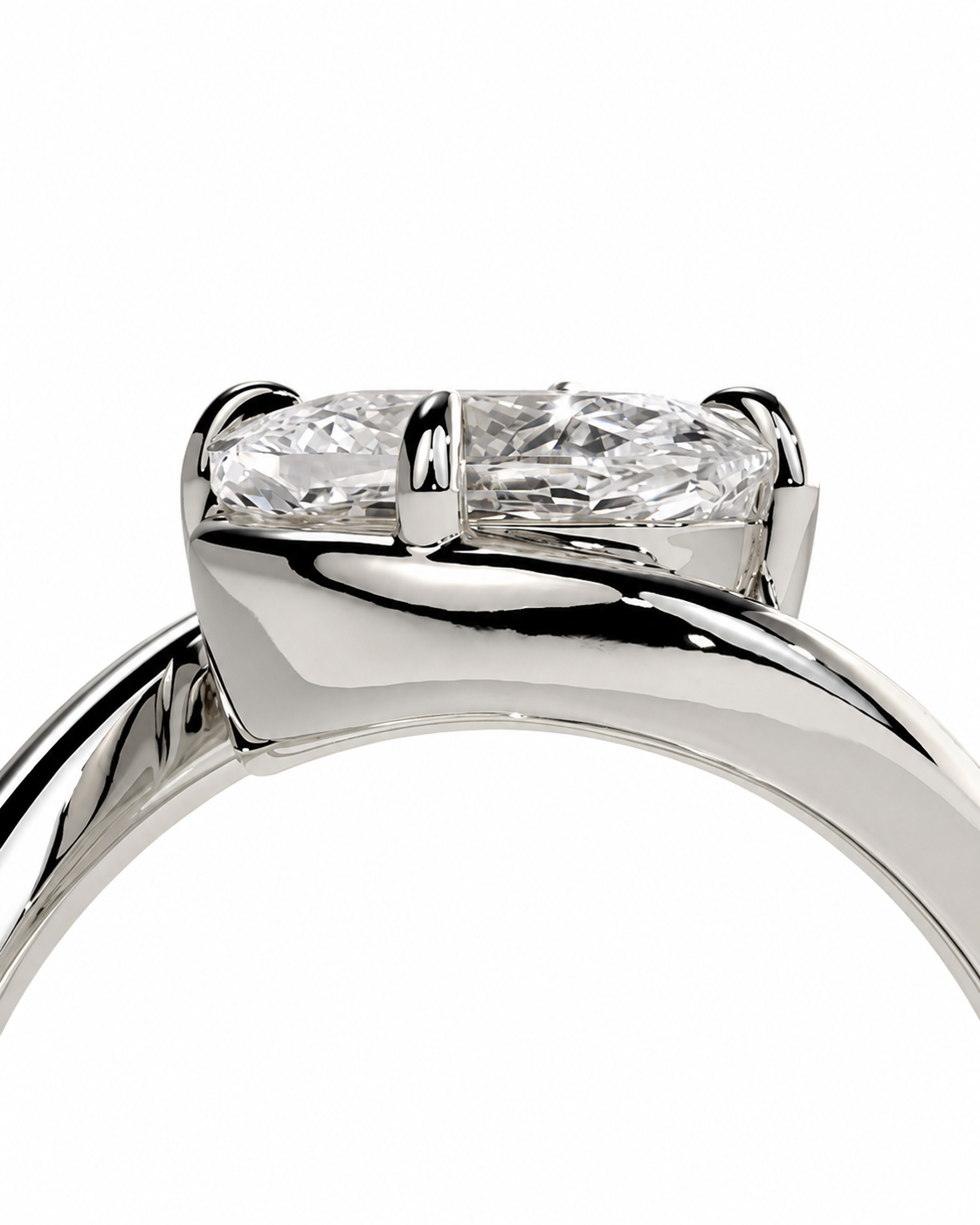color_925_SIL,color_935_ARG,color_10K_WG, color_14K_WG &&Close-up of a silver-toned ring with a marquise-cut clear gemstone in a four-prong setting, shown against a plain white background.