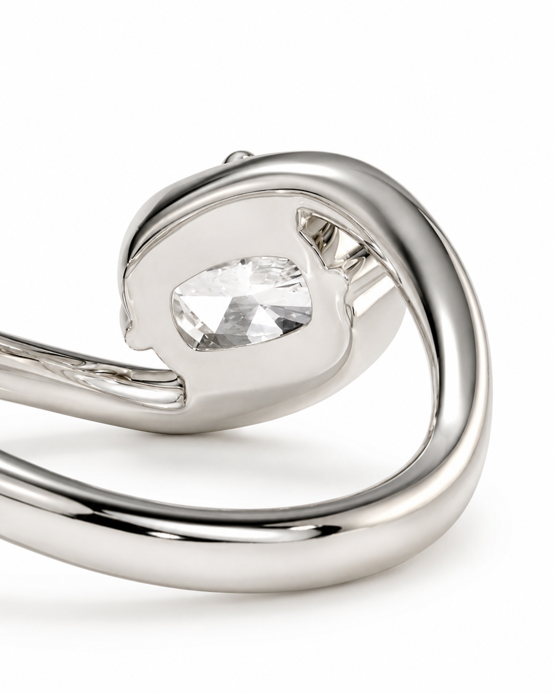 color_925_SIL,color_935_ARG,color_10K_WG, color_14K_WG &&A close-up of a polished silver-toned ring featuring a clear, faceted marquise-cut gemstone in a prong setting, shown against a clean white background.