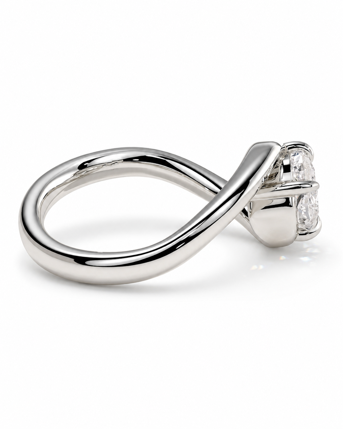 color_925_SIL,color_935_ARG,color_10K_WG, color_14K_WG &&A polished silver ring with a twisted infinity-style band and a small cluster of clear gemstones in a prong setting, shown on a clean white background.
