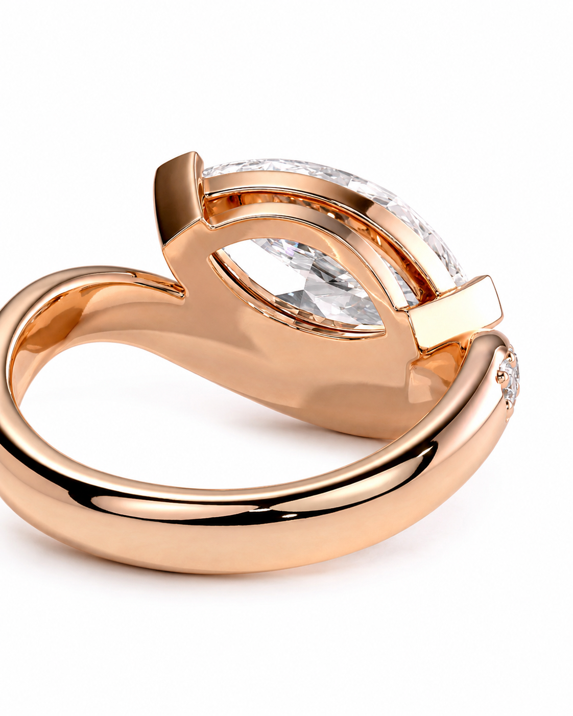 color_10K_RG, color_14K_RG &&A close-up shot of a rose gold ring with a marquise-cut clear gemstone in a curved setting, on a white background.