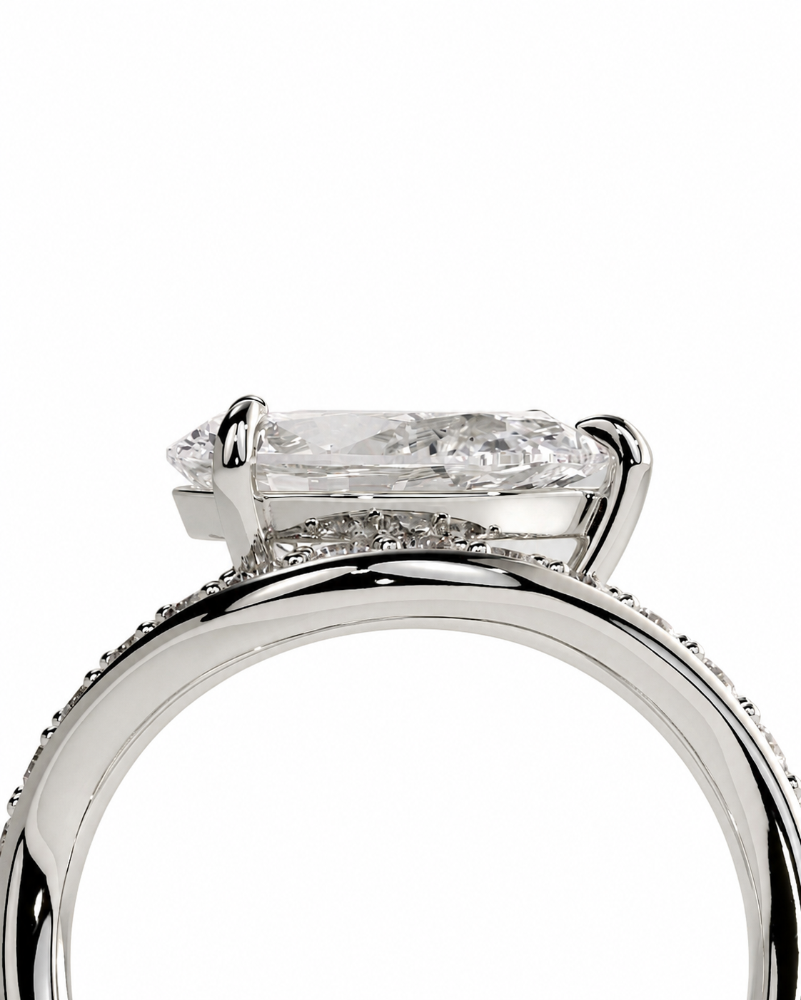 color_925_SIL,color_935_ARG,color_10K_WG, color_14K_WG &&A close-up studio shot of a silver-toned ring featuring a large rectangular clear gemstone in a prong setting, with smaller accent stones along the band, on a plain white background.