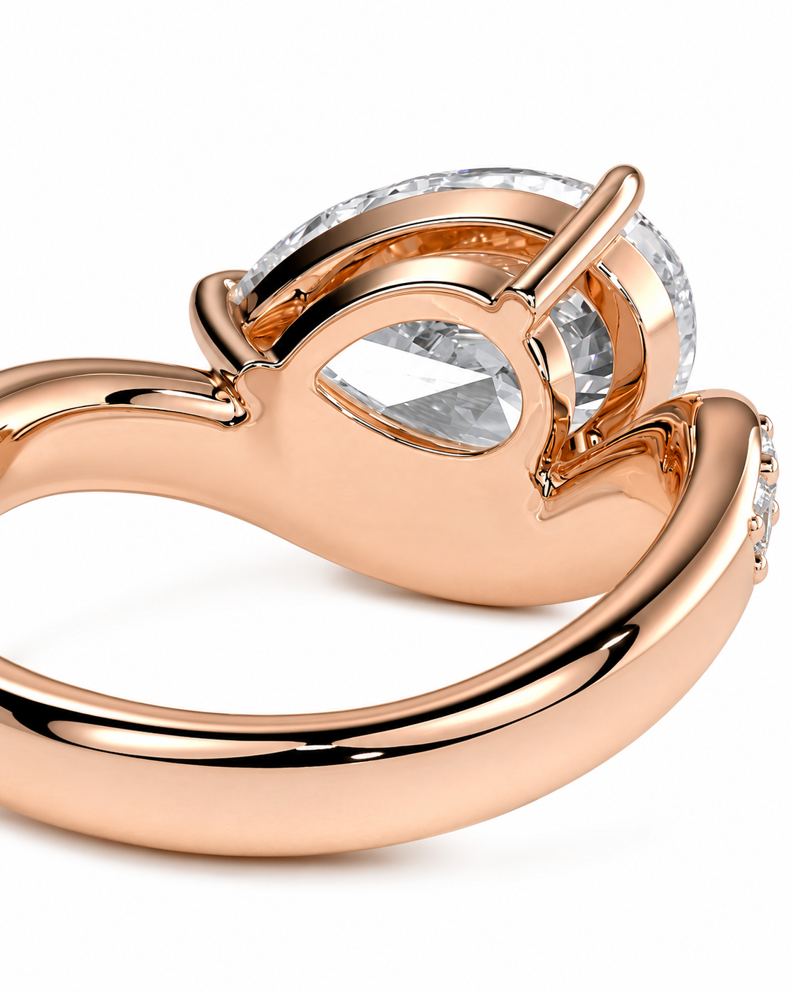 color_10K_RG, color_14K_RG &&Rose gold ring with a large pear-cut clear center stone and a halo of smaller clear stones, shown on a white background.
