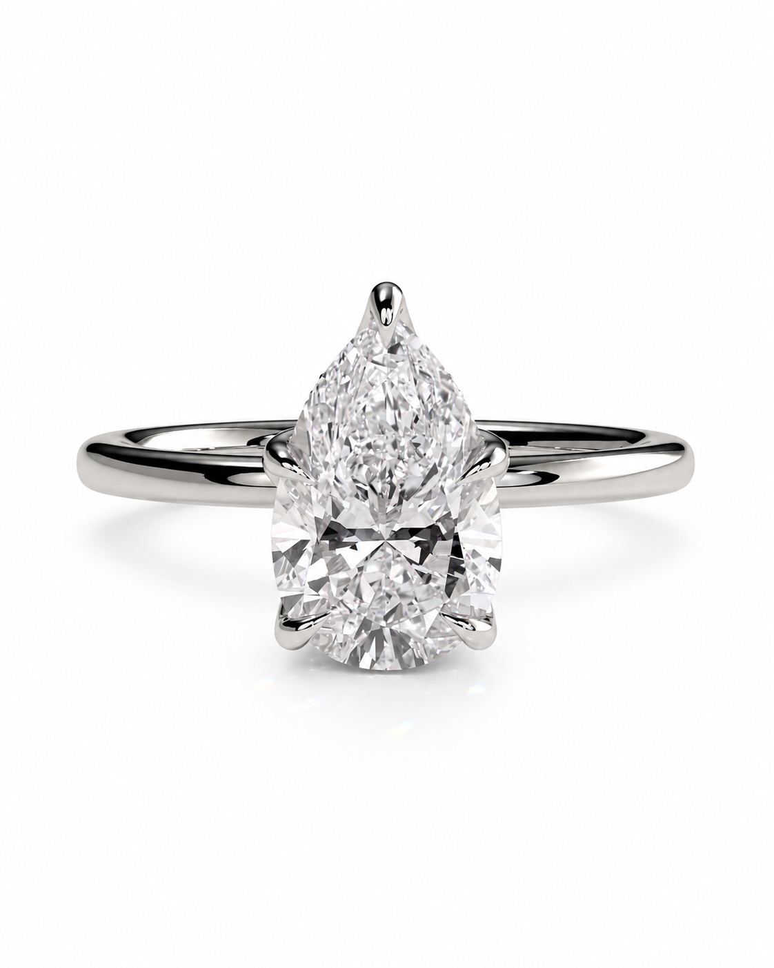 color_925_SIL,color_935_ARG,color_10K_WG, color_14K_WG &&A pear-cut diamond solitaire engagement ring in a polished silver-colored metal band, set against a clean white background.
