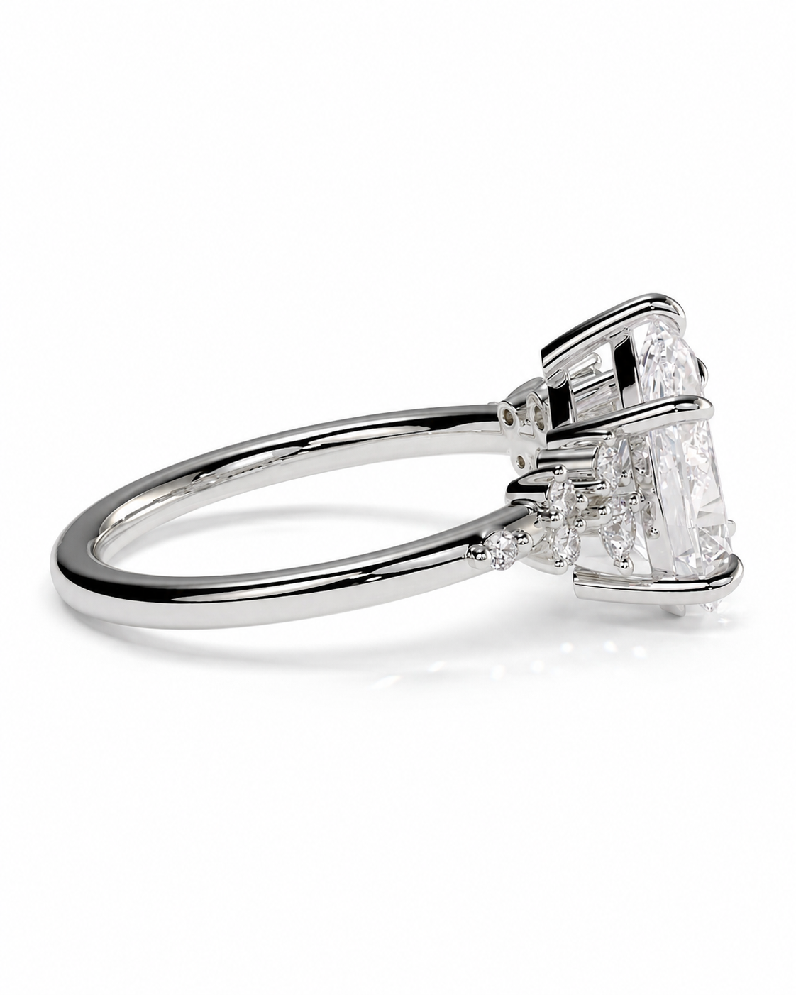 color_925_SIL,color_935_ARG,color_10K_WG, color_14K_WG &&A silver-toned diamond ring with a large emerald-cut center stone and smaller accent diamonds, shown in a three-quarter side view on a white background.