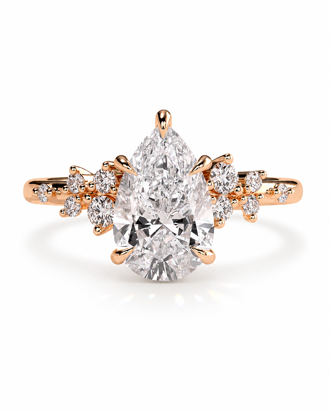 color_10K_RG, color_14K_RG &&A rose gold ring featuring a large pear-cut center stone and smaller round stones along the shoulders, set against a clean white background.