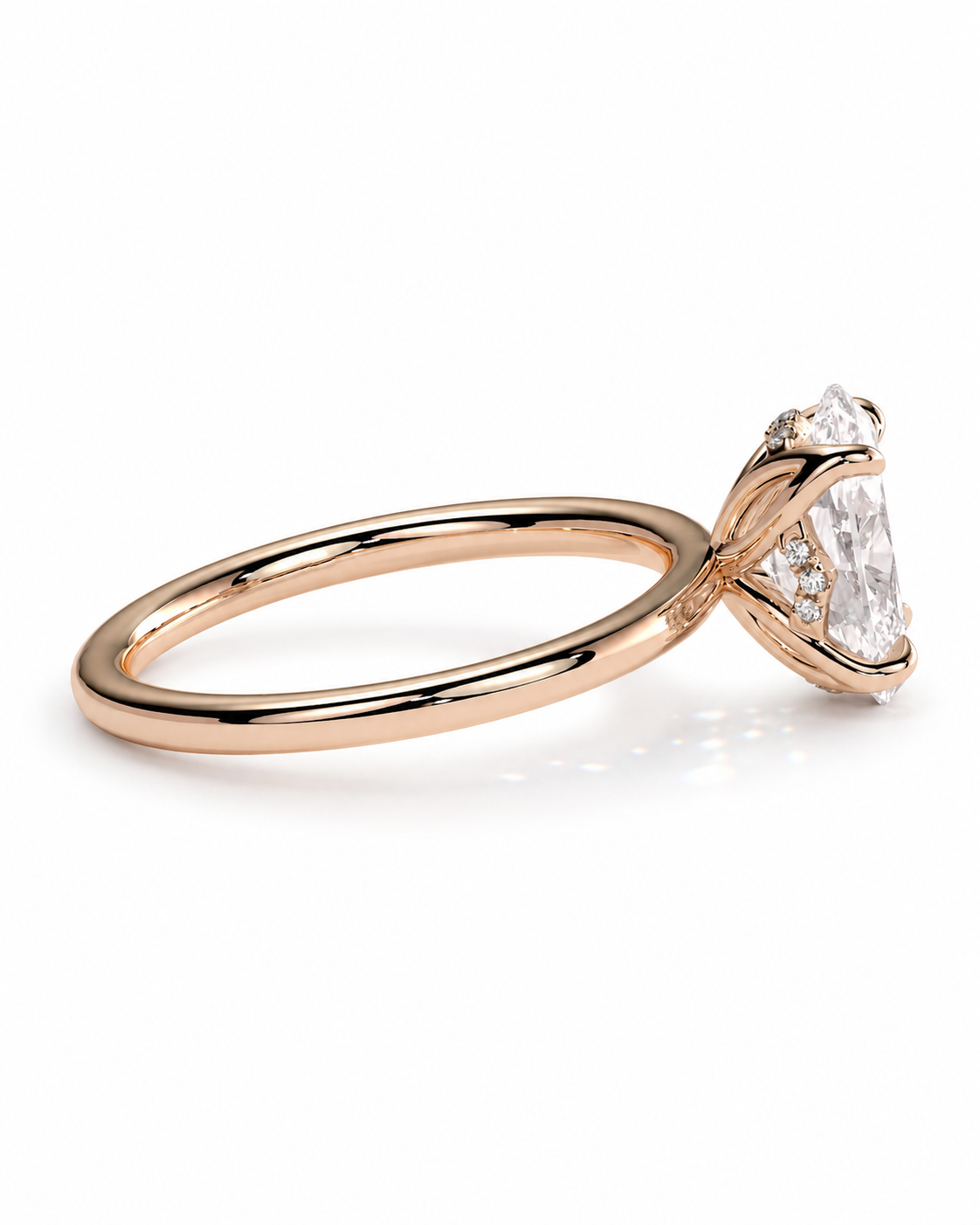 color_10K_RG, color_14K_RG &&A rose gold engagement ring featuring a large pear-cut diamond center stone and smaller diamonds along the band, set against a clean white background.