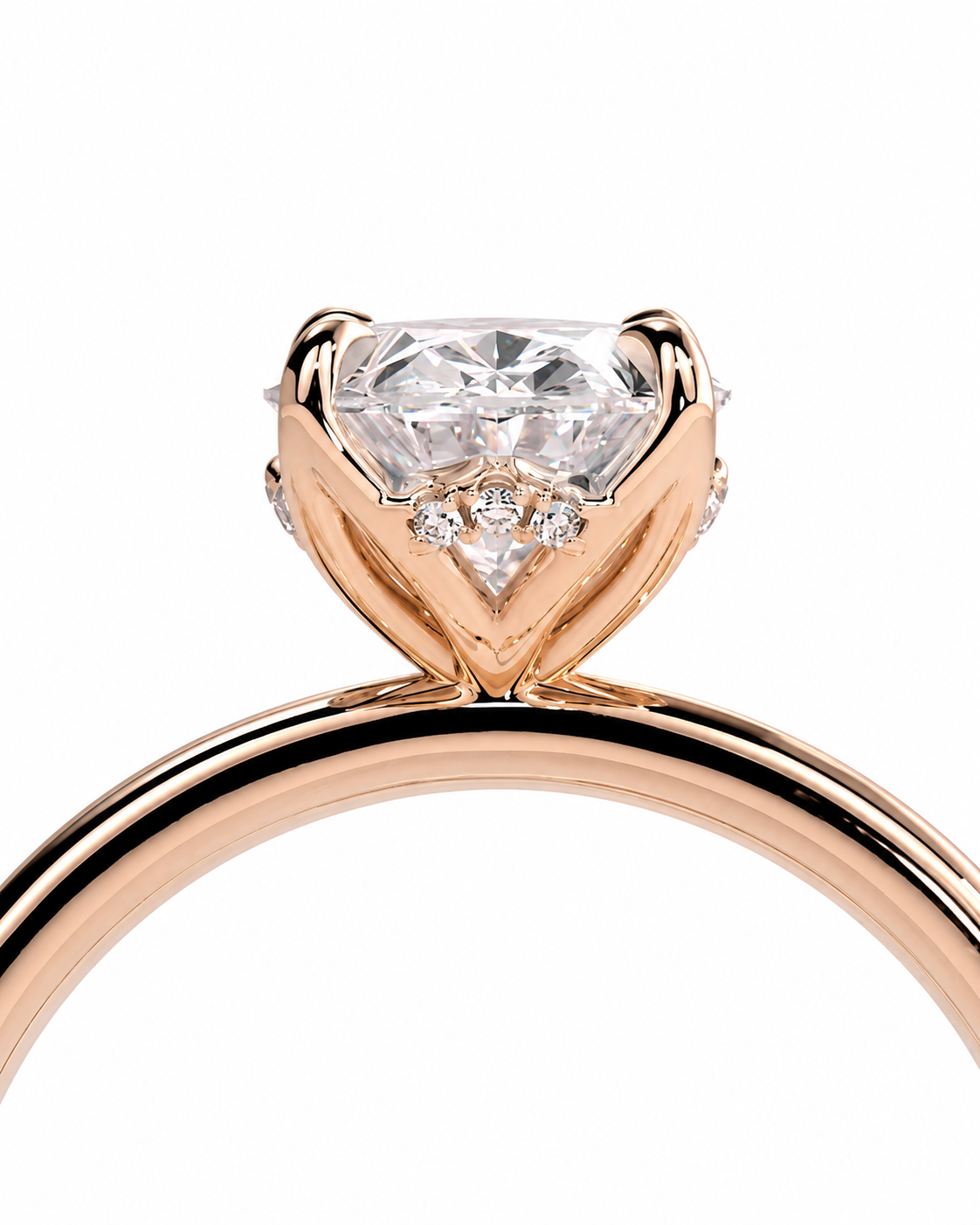 color_10K_RG, color_14K_RG &&A close-up of a rose gold solitaire engagement ring featuring a heart-shaped clear gemstone in a prong setting with small accent diamonds, shown on a plain white background.