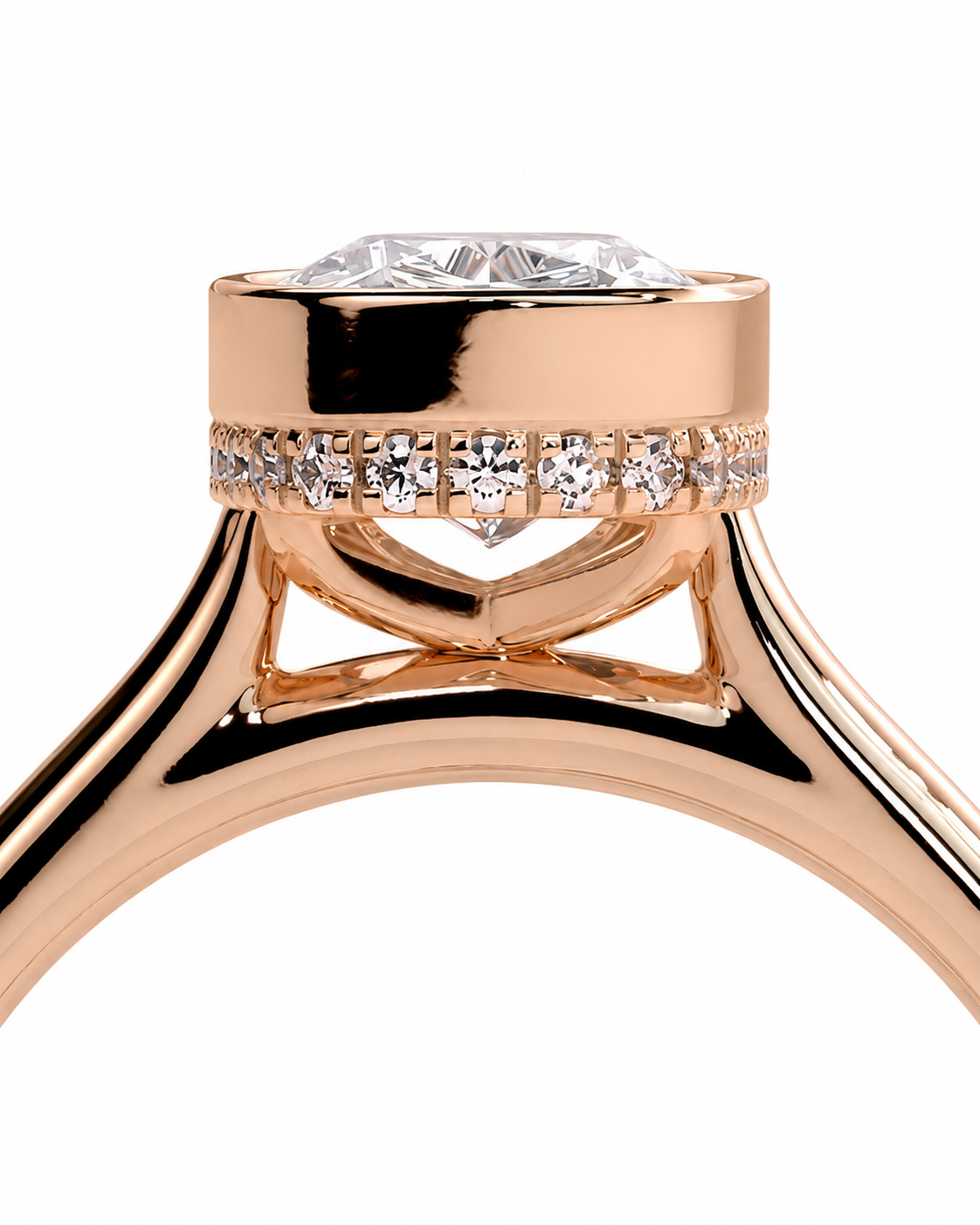 color_10K_RG, color_14K_RG &&Close-up of a rose gold ring with a large round clear gemstone in a prong setting, accented by a row of small pavé-set diamonds around the band, on a white background.