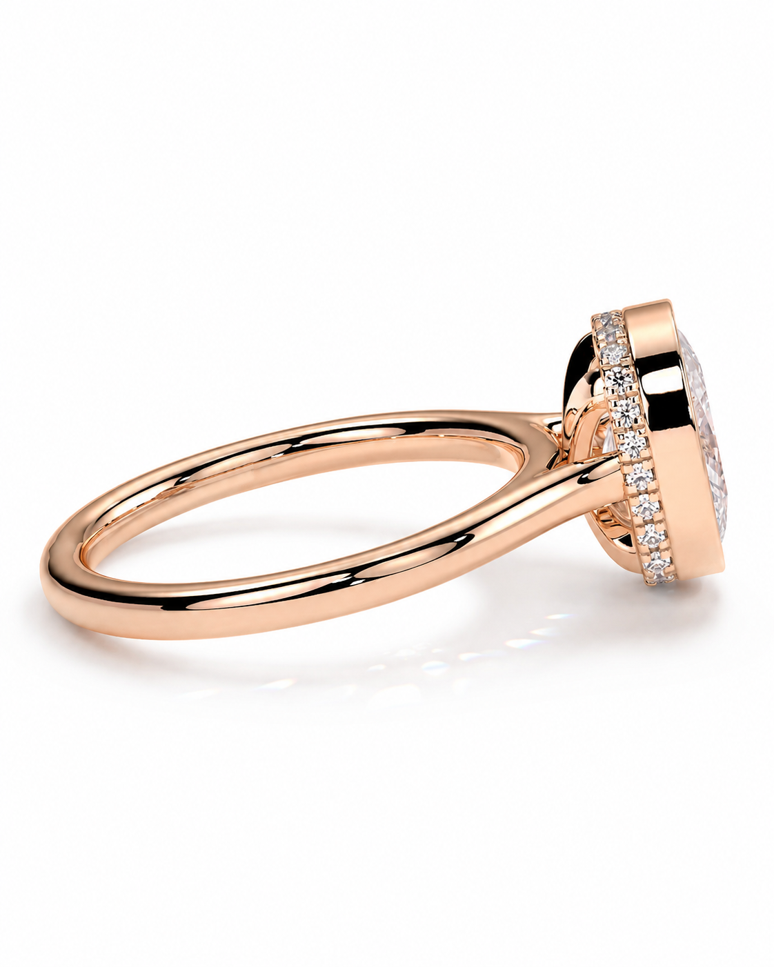 color_10K_RG, color_14K_RG &&A rose gold ring with a halo setting featuring small clear stones, shown from a side angle on a clean white background.