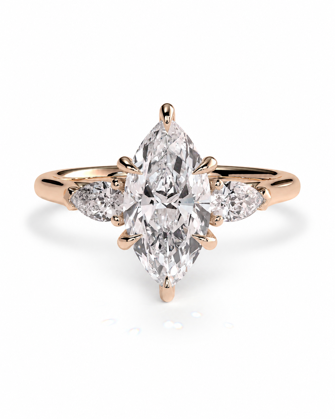 color_10K_RG, color_14K_RG &&A rose gold ring featuring a large marquise-cut center diamond flanked by two smaller round diamonds on the band, set against a clean white background.
