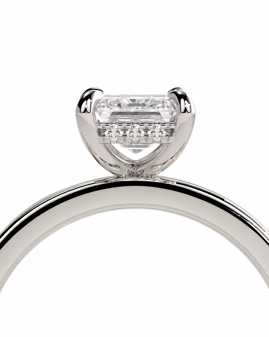 color_925_SIL,color_935_ARG,color_10K_WG, color_14K_WG &&A close-up studio shot of a silver-toned ring featuring a rectangular clear gemstone in a prong setting with a row of smaller diamonds along the band, shown against a plain white background.