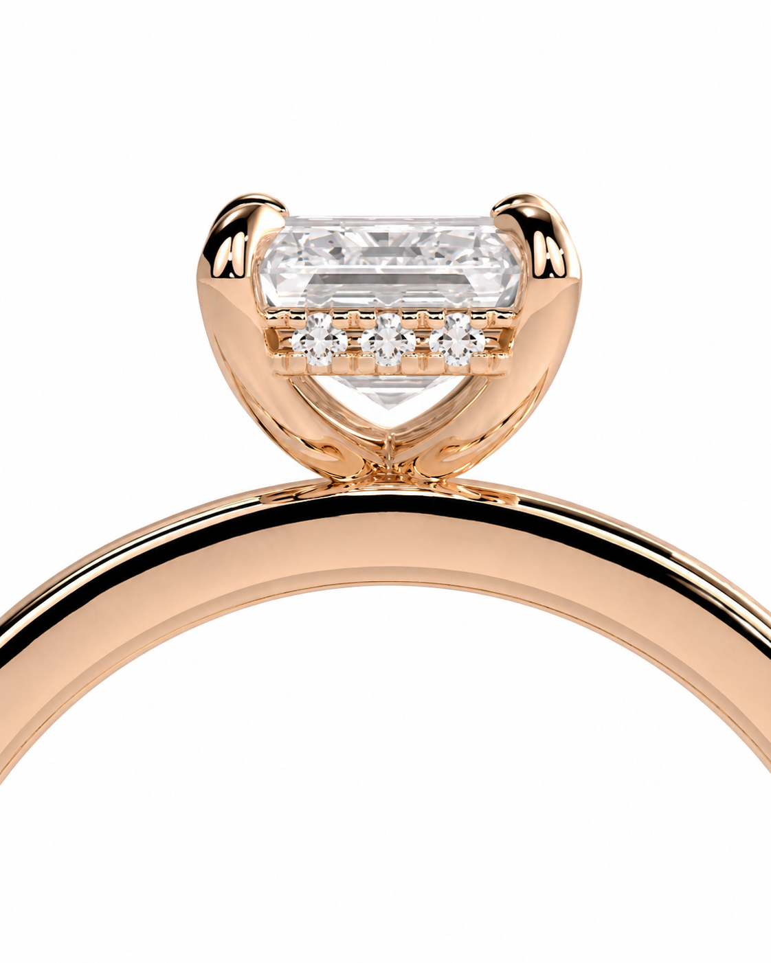 color_10K_RG, color_14K_RG &&Rose gold ring with a large rectangular clear center stone and three small clear stones in a row below, shown on a plain white background.