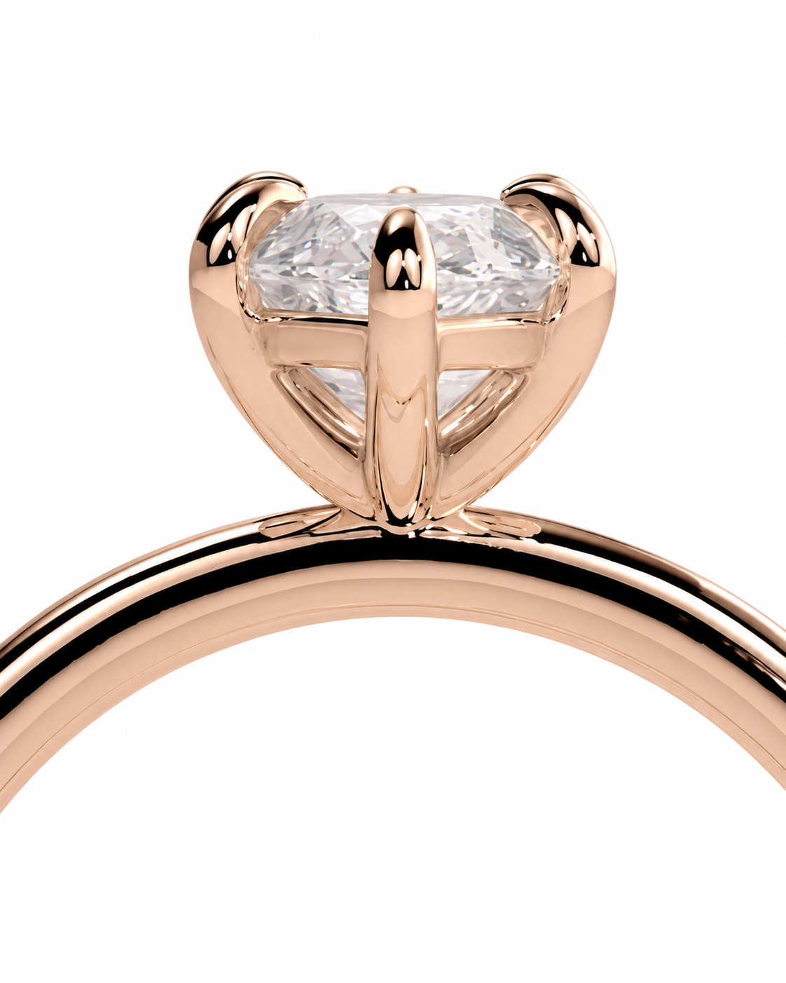 color_10K_RG, color_14K_RG &&Close-up of a rose gold solitaire ring with a clear rectangular gemstone in a four-prong setting, shown against a plain white background.