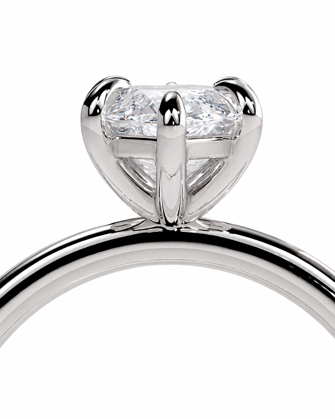 color_925_SIL,color_935_ARG,color_10K_WG, color_14K_WG &&Close-up of a silver-toned solitaire ring with a clear round-cut gemstone in a four-prong setting, shown against a plain white background.