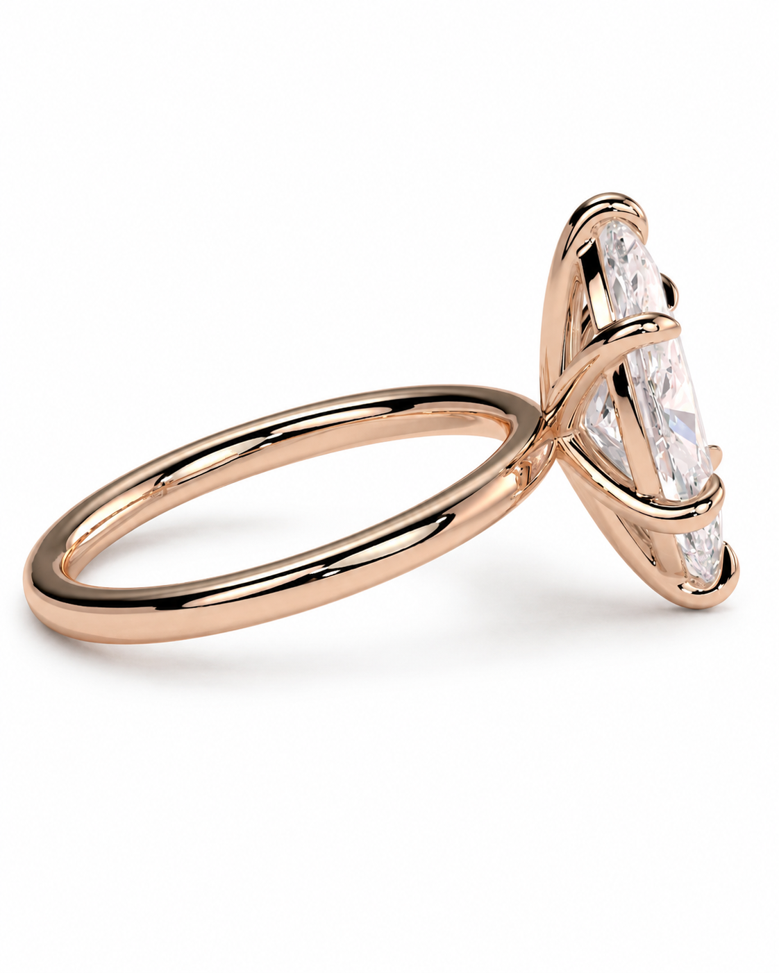 color_10K_RG, color_14K_RG &&A rose gold ring with a large marquise-cut clear gemstone in a prong setting, shown on a clean white background.
