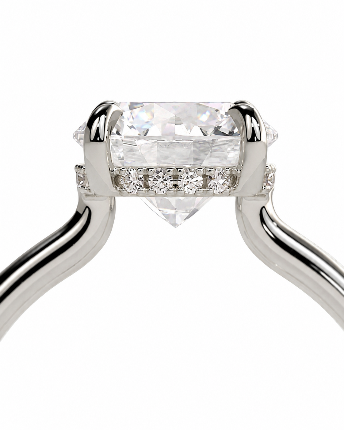 color_925_SIL,color_935_ARG,color_10K_WG, color_14K_WG &&A close-up of a silver-toned solitaire engagement ring featuring a large rectangular clear gemstone in a four-prong setting, with a row of small round diamonds along the band, on a plain white background.