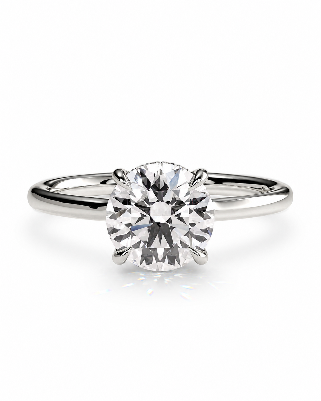 color_925_SIL,color_935_ARG,color_10K_WG, color_14K_WG &&A classic solitaire engagement ring featuring a round brilliant-cut diamond set in a polished silver-colored metal band, shown on a clean white background with a subtle reflection.