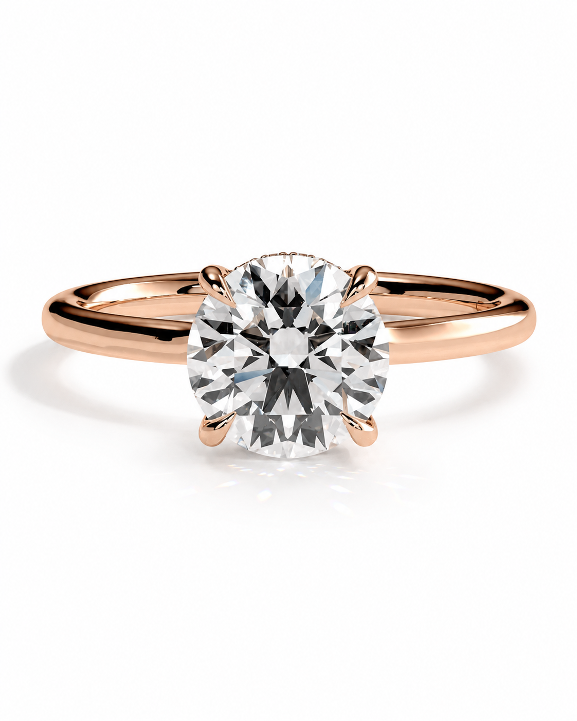 color_10K_RG, color_14K_RG &&A classic solitaire engagement ring featuring a round brilliant-cut diamond set in a rose gold four-prong band, shown on a clean white background with a soft reflection.