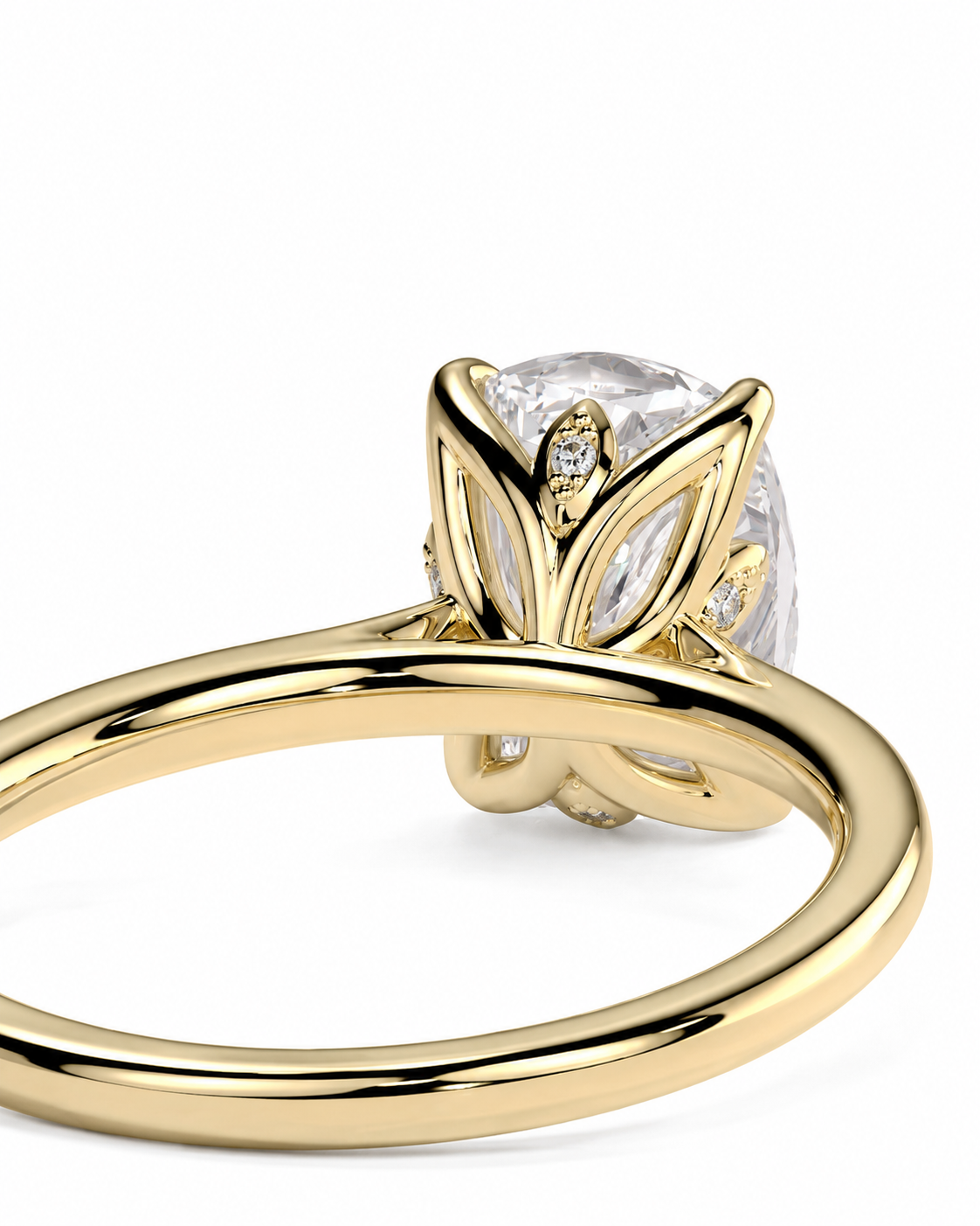 color_10K_YG, color_14K_YG &&A close-up of a yellow gold ring with a large clear oval center stone and small accent stones in a leaf-like setting, shown on a white background.