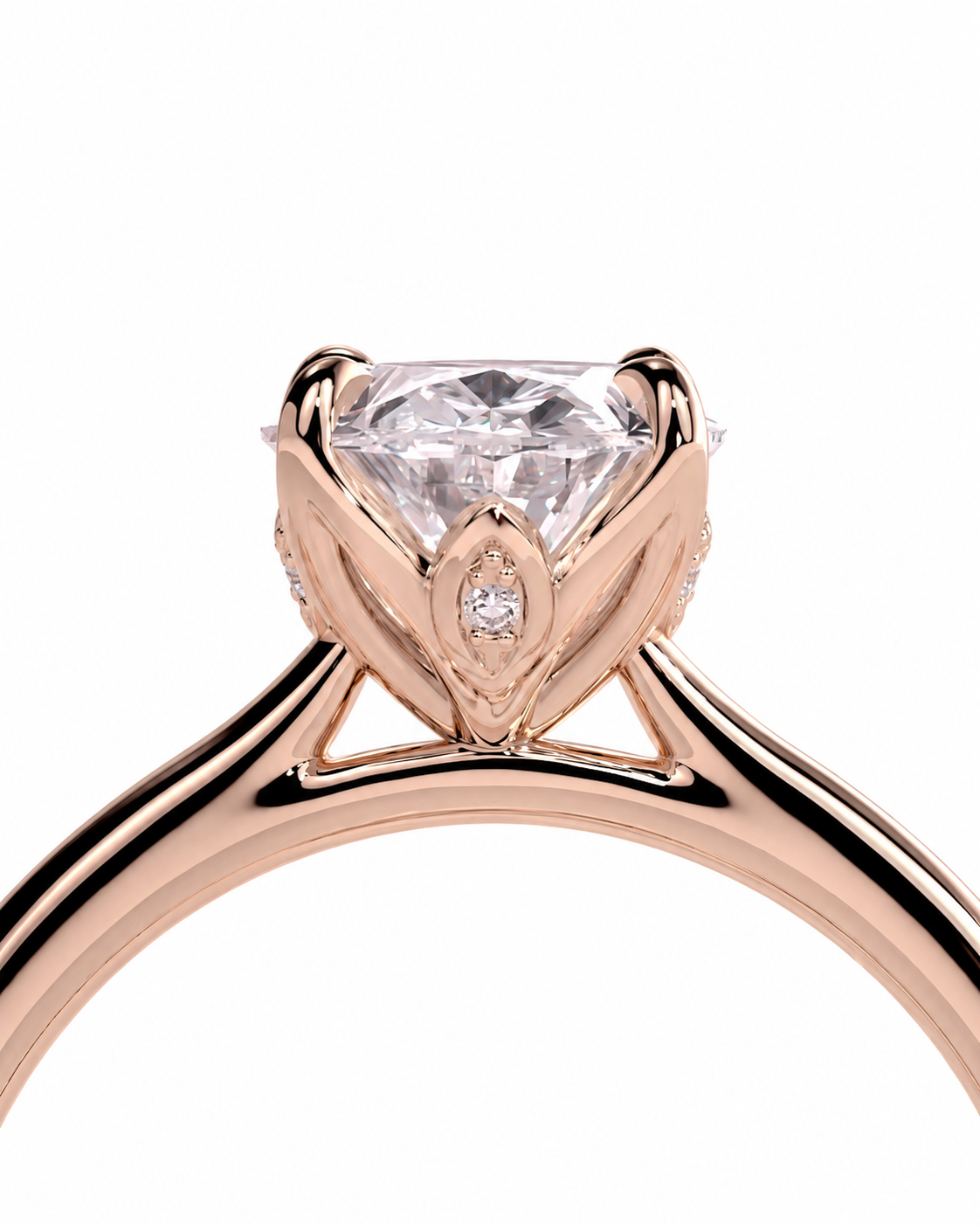 color_10K_RG, color_14K_RG &&Rose gold ring with a large round brilliant-cut center stone and a small accent stone, shown in a close-up studio shot on a white background.