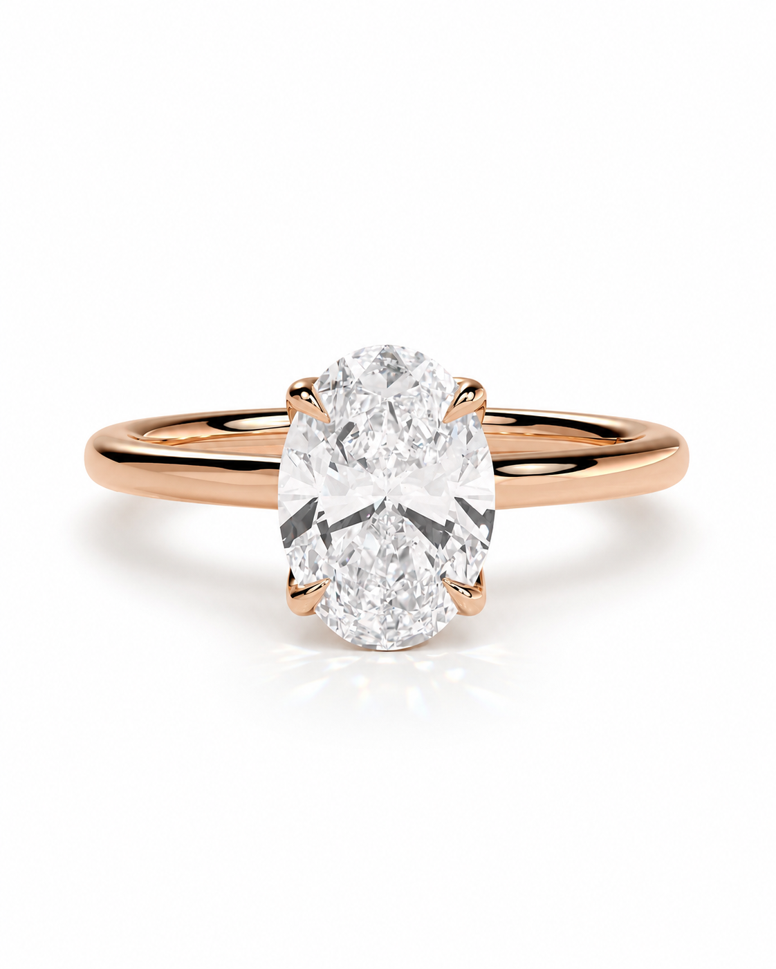 color_10K_RG, color_14K_RG &&An oval-cut diamond engagement ring with a rose gold band, shown on a clean white background with a soft reflection.