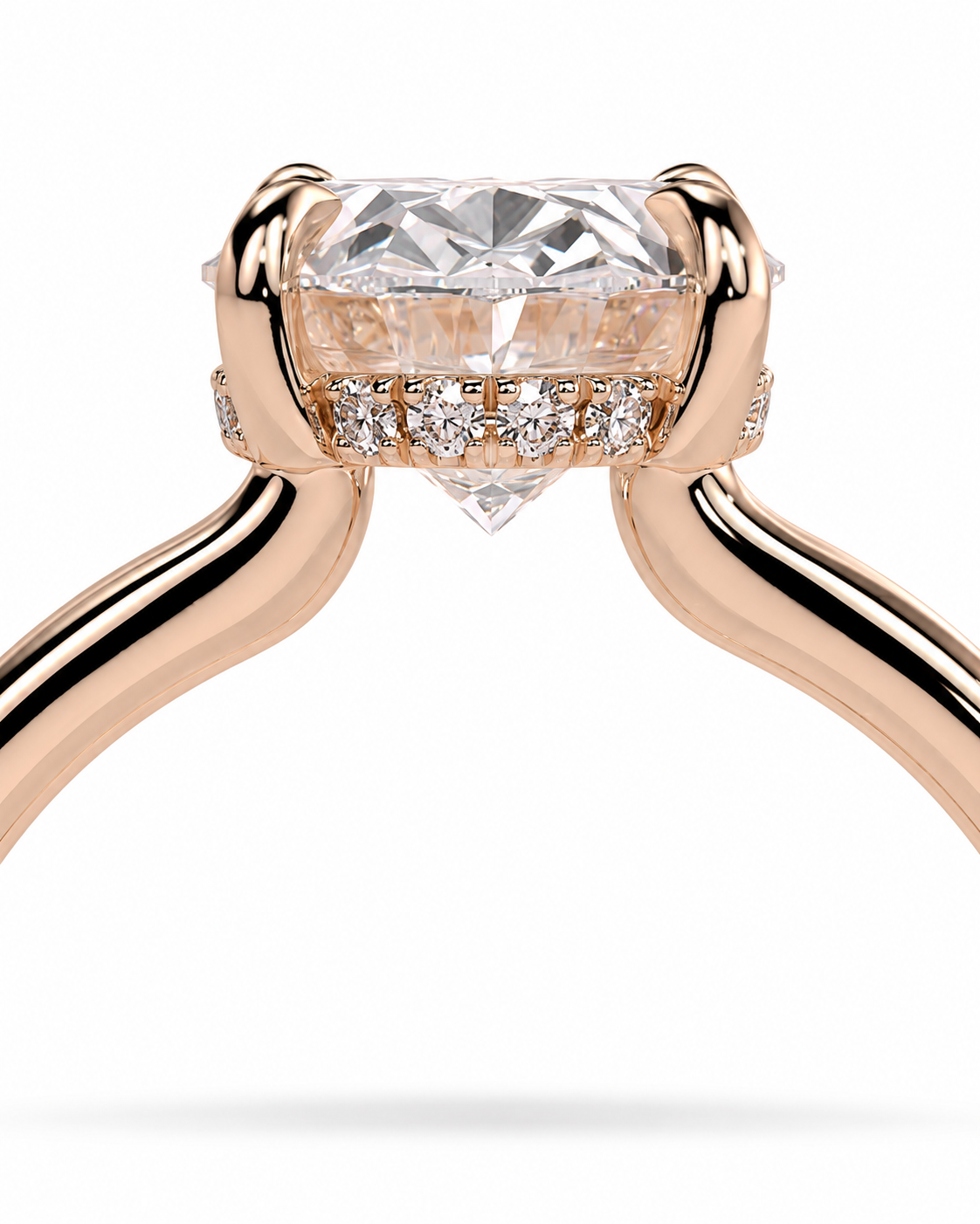 color_10K_RG, color_14K_RG &&A close-up of a rose gold ring with a large round-cut center stone and a halo of small diamonds, shown on a clean white background.
