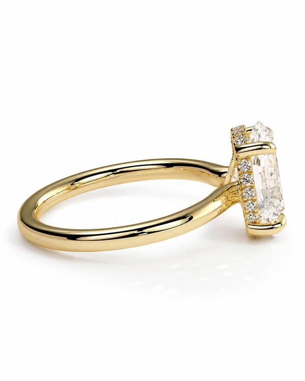 color_10K_YG, color_14K_YG &&AA yellow gold ring featuring a large rectangular emerald-cut diamond center stone and smaller accent diamonds on the band, shown on a clean white background.