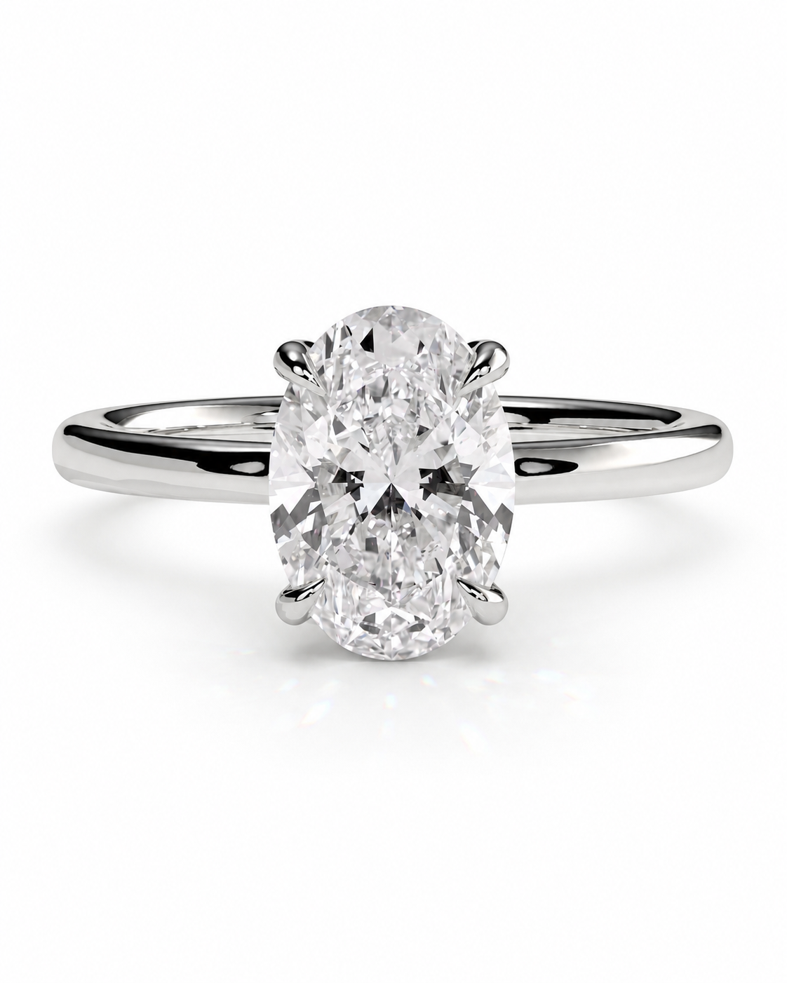 color_925_SIL,color_935_ARG,color_10K_WG, color_14K_WG &&An oval-cut diamond solitaire engagement ring in a polished four-prong setting on a sleek silver band, shown against a clean white background.