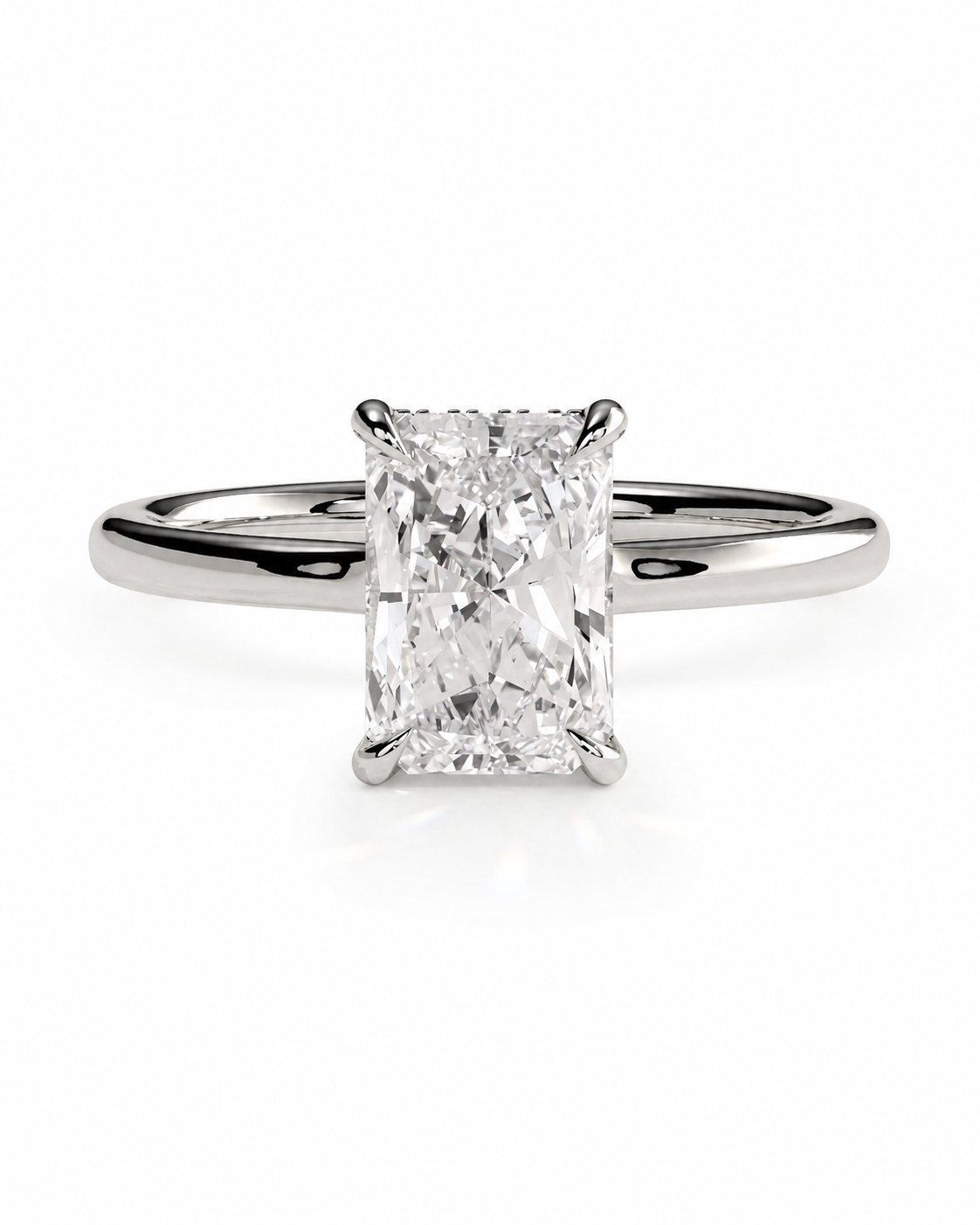 color_925_SIL,color_935_ARG,color_10K_WG, color_14K_WG &&An emerald-cut diamond engagement ring with a polished silver-colored band, shown on a clean white background.