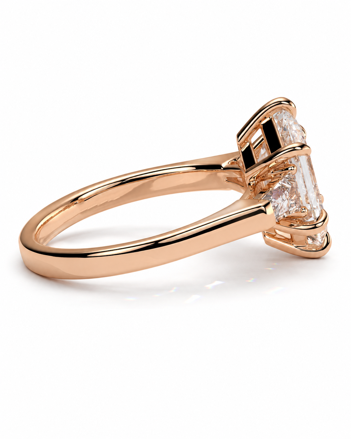 color_10K_RG, color_14K_RG &&Rose gold ring with a large baguette-cut clear gemstone in a prong setting, shown on a clean white background.