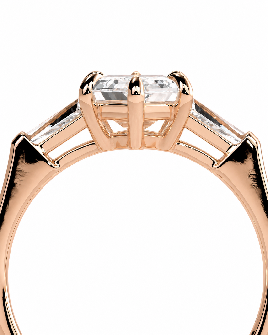 color_10K_RG, color_14K_RG &&Close-up of a rose gold ring with a central rectangular clear gemstone and two smaller side stones on a white background.